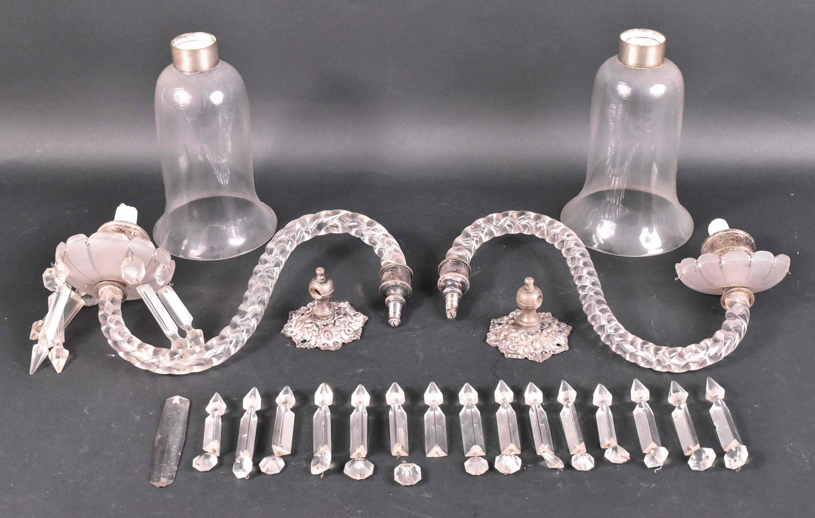 Pair of Crystal One-Arm Wall Sconces: 19th/20th C., with white-metal and twisted glass style arms. Losses to crystals. Apx. 15"h x 13-1/2"d