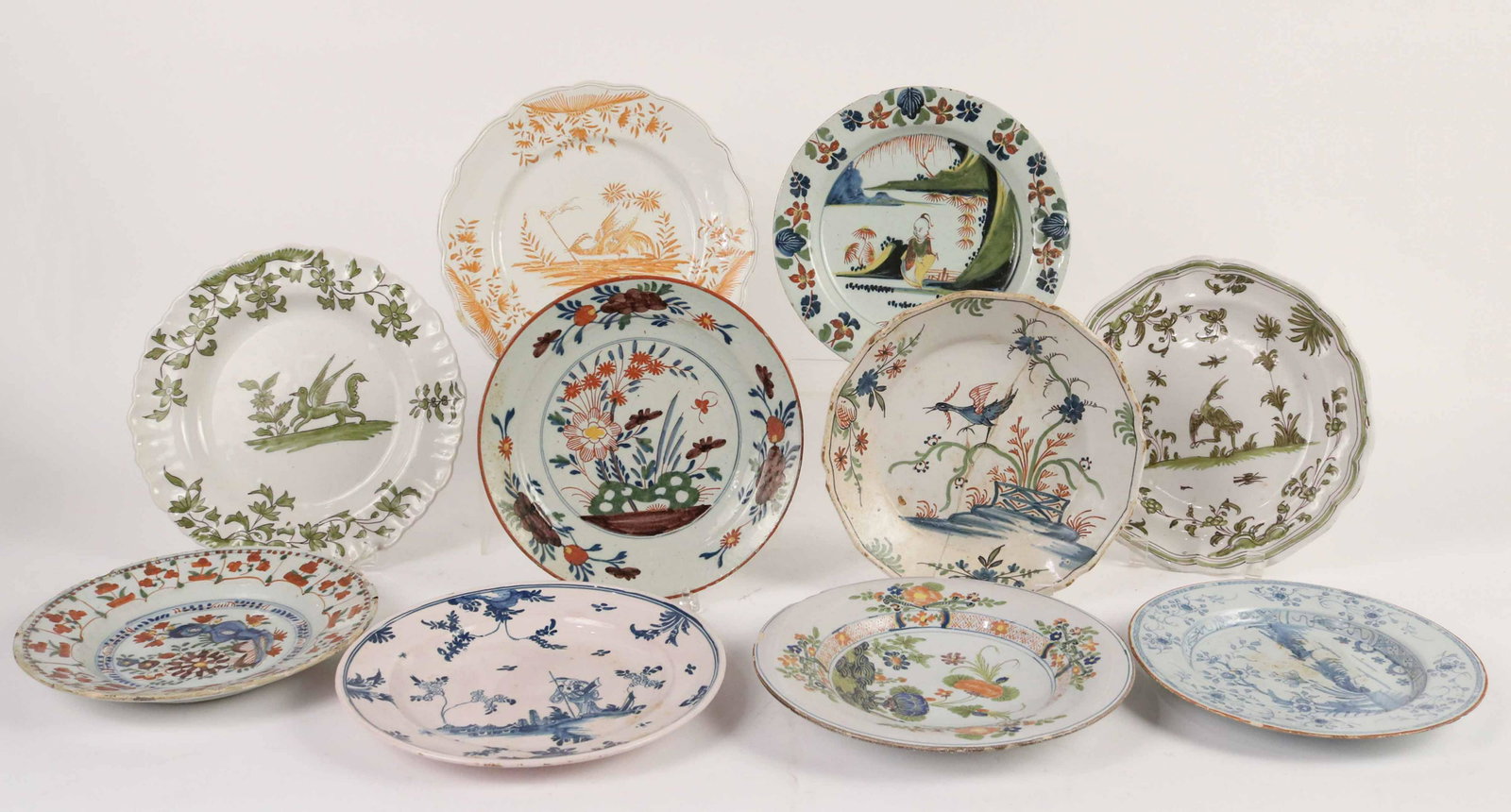 Ten Tin Glazed Earthenware Plates: English and French Faience, 18th/19th Century. Provenance: Property from the Estate of Judith Applegate, Princeton, NJ.