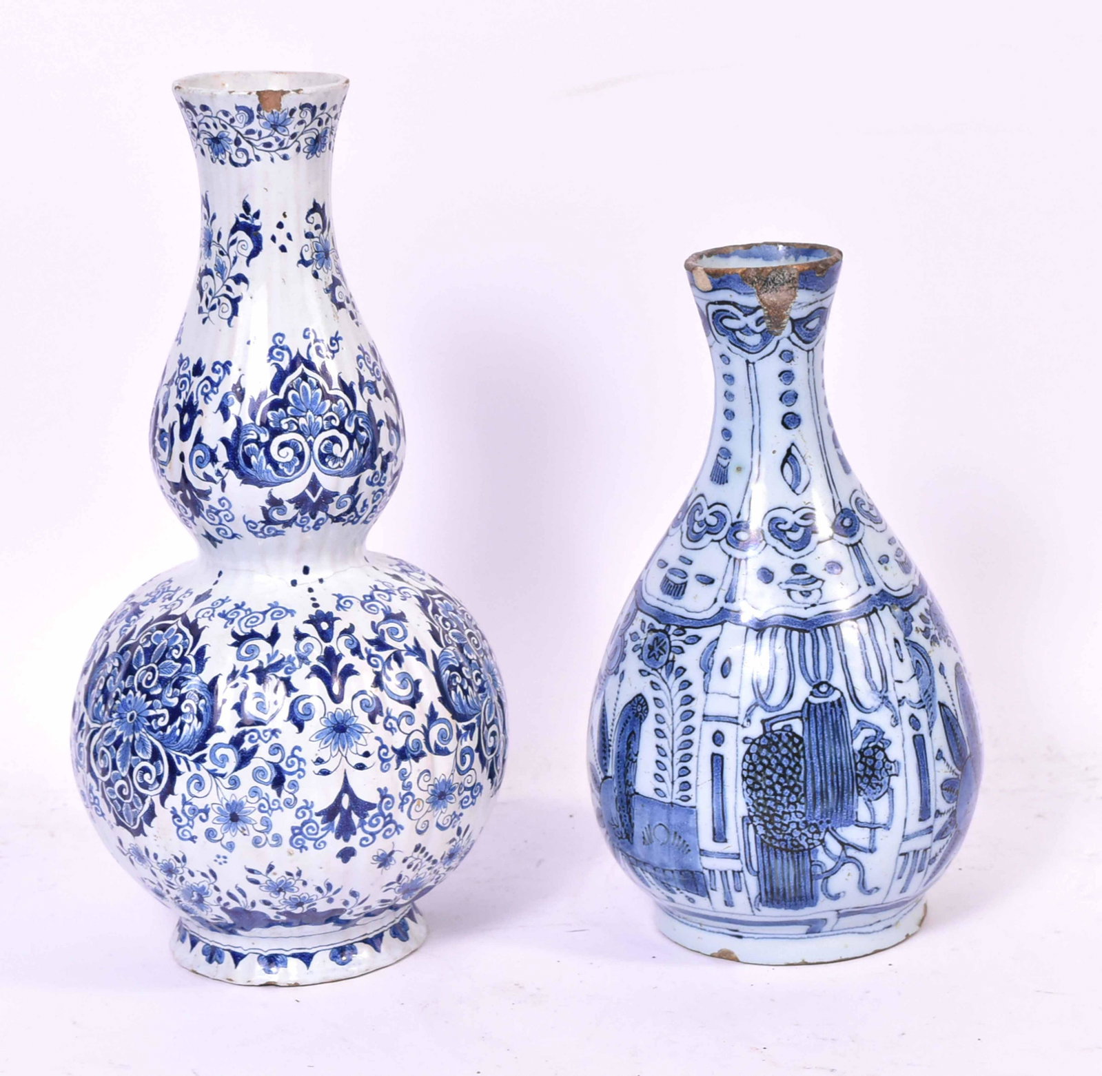 Delft Tin Glazed Blue & White Bottle Neck Vase: Dutch, circa 1680. With Buddhist symbols. Together with a Dutch Delft tin earthenware double gourd vase, late 18th Century. Size: 9"h & 12"h Provenance: Property from the Estate of Judith Applegate, P