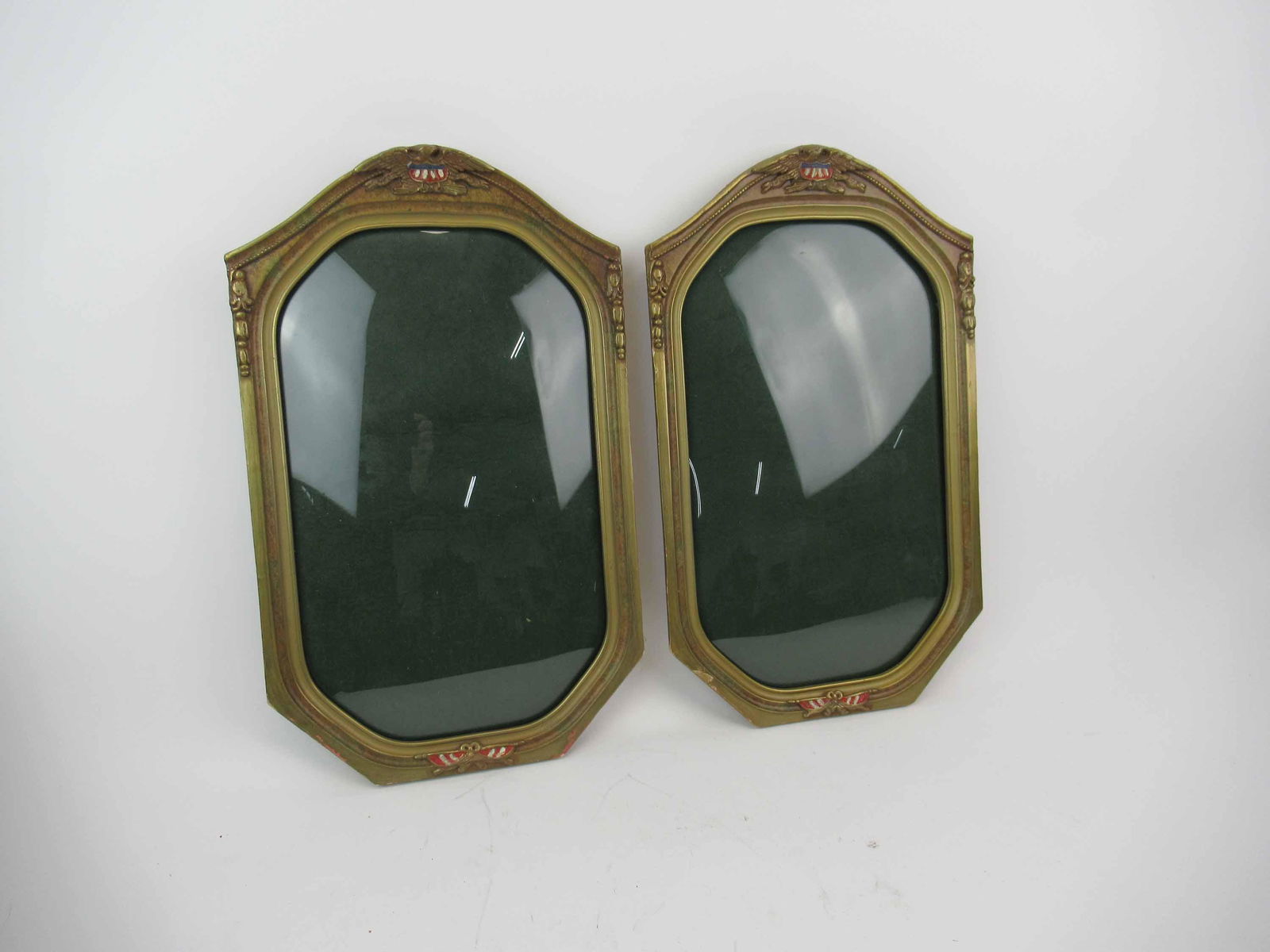 Pair of Patriotic Convex Gilt Frames: Pair of Patriotic Convex Gilt Frames. Used condition. Wear, worn, minor chips and crack to eagle. 18"h x 11"w