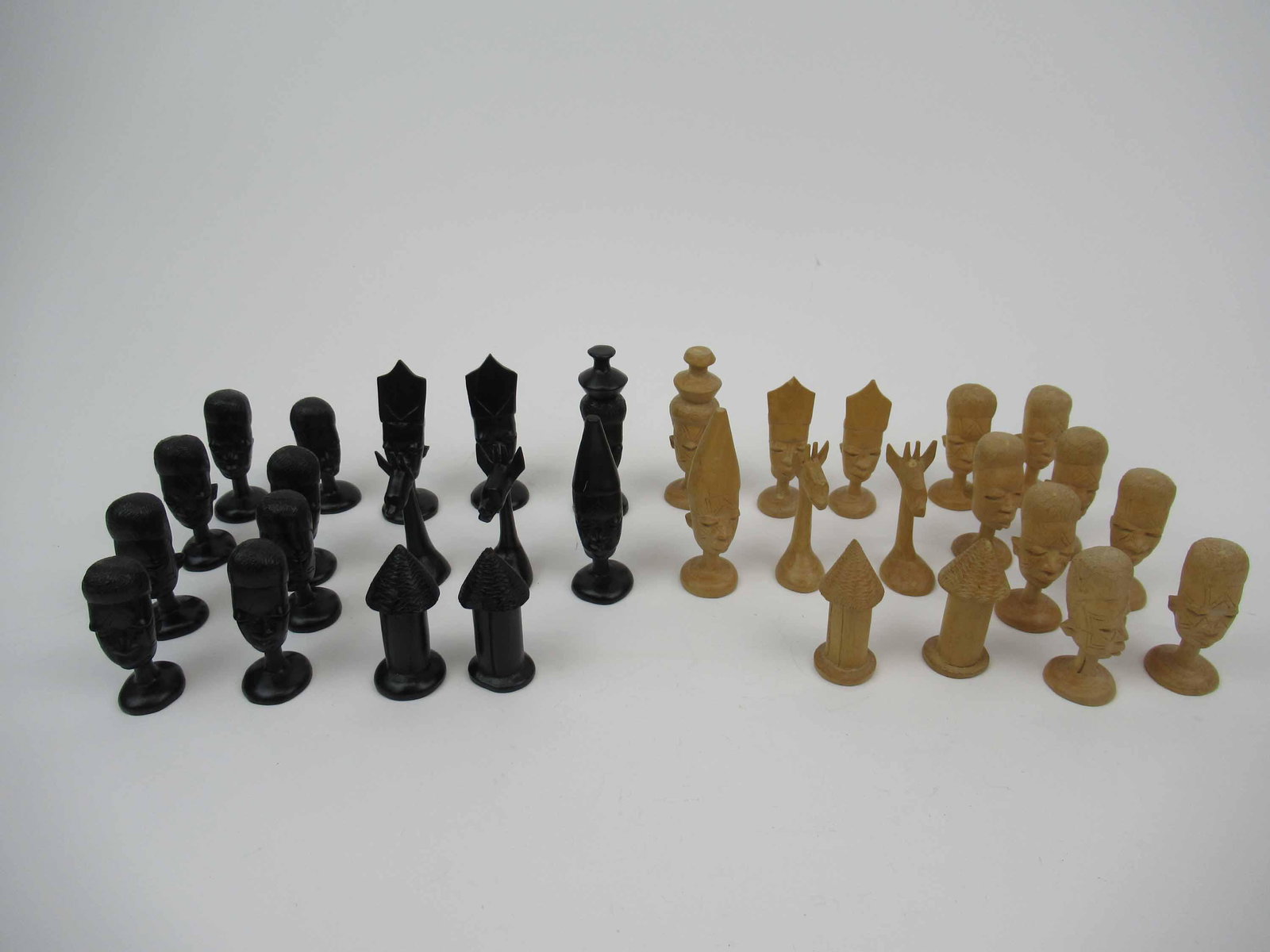 Hand Carved African Wood Chess Pieces: Hand Carved African Wood Chess Pieces. Used condition. Losses. 2.5"h