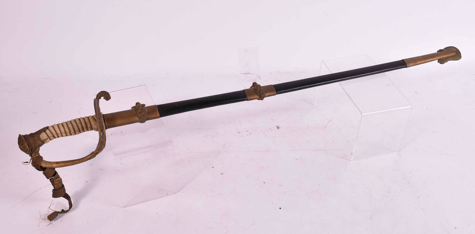 United States Naval Military Sword: United States Naval Military Sword. 19th C., with leather scabbard and etched blade "A. Shuman & Co. Boston, Mass." with shagreen and wire grip. Used condition, wrapping is loose on grip. surface dist