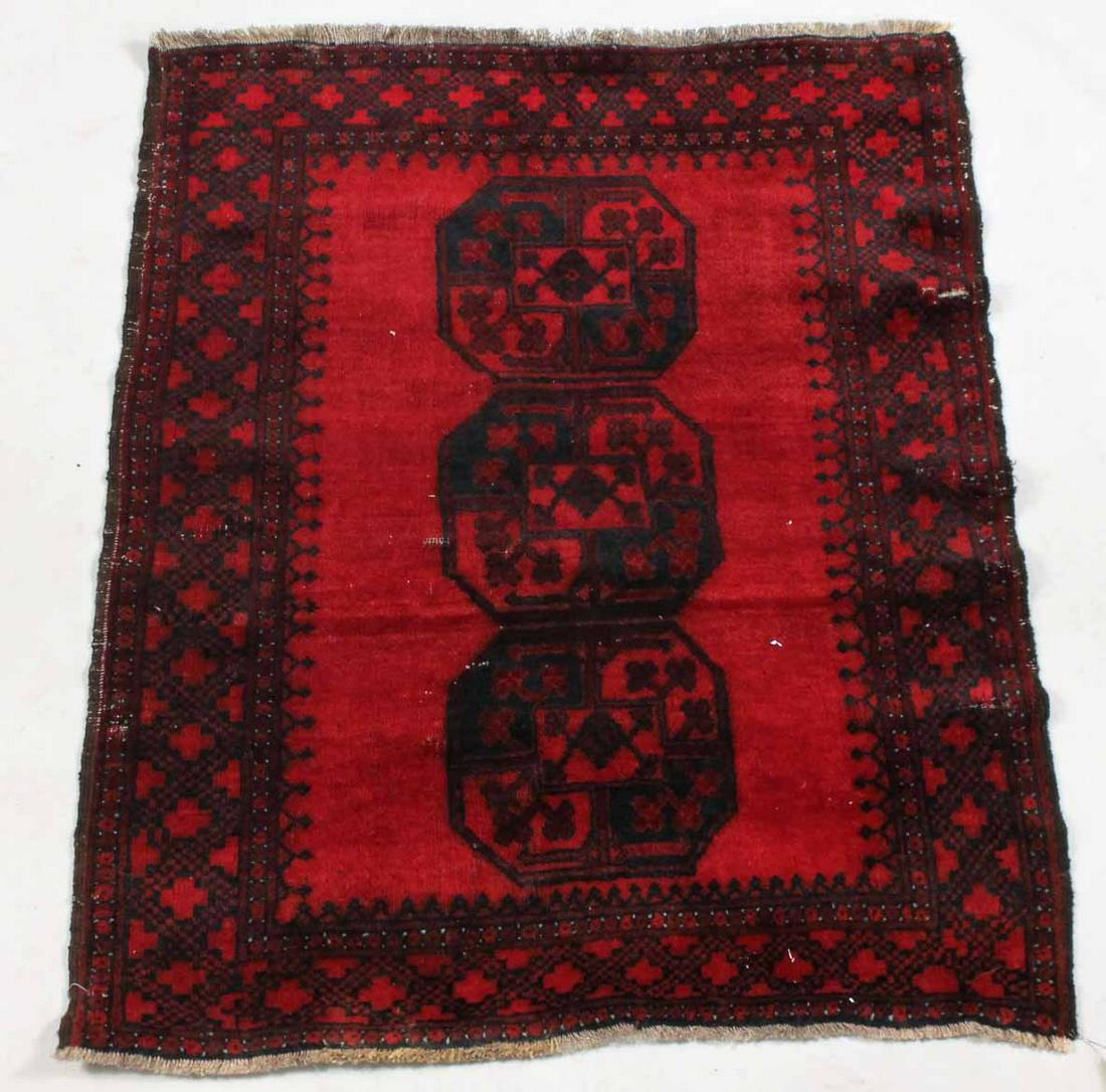 Afghan Throw Rug: With dark blue medallions and border on a red field. 4'l x 3'4"w