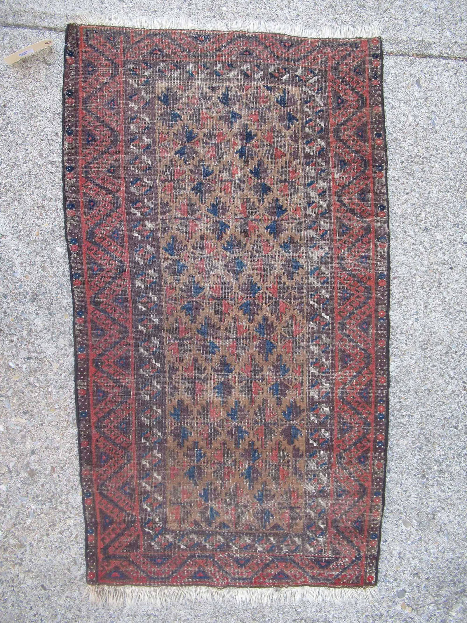 Caucasian Area Rug With Central Taupe Tone: Caucasian Area Rug With Central Taupe Tone. Used condition, wear, worn. 55" x 32"