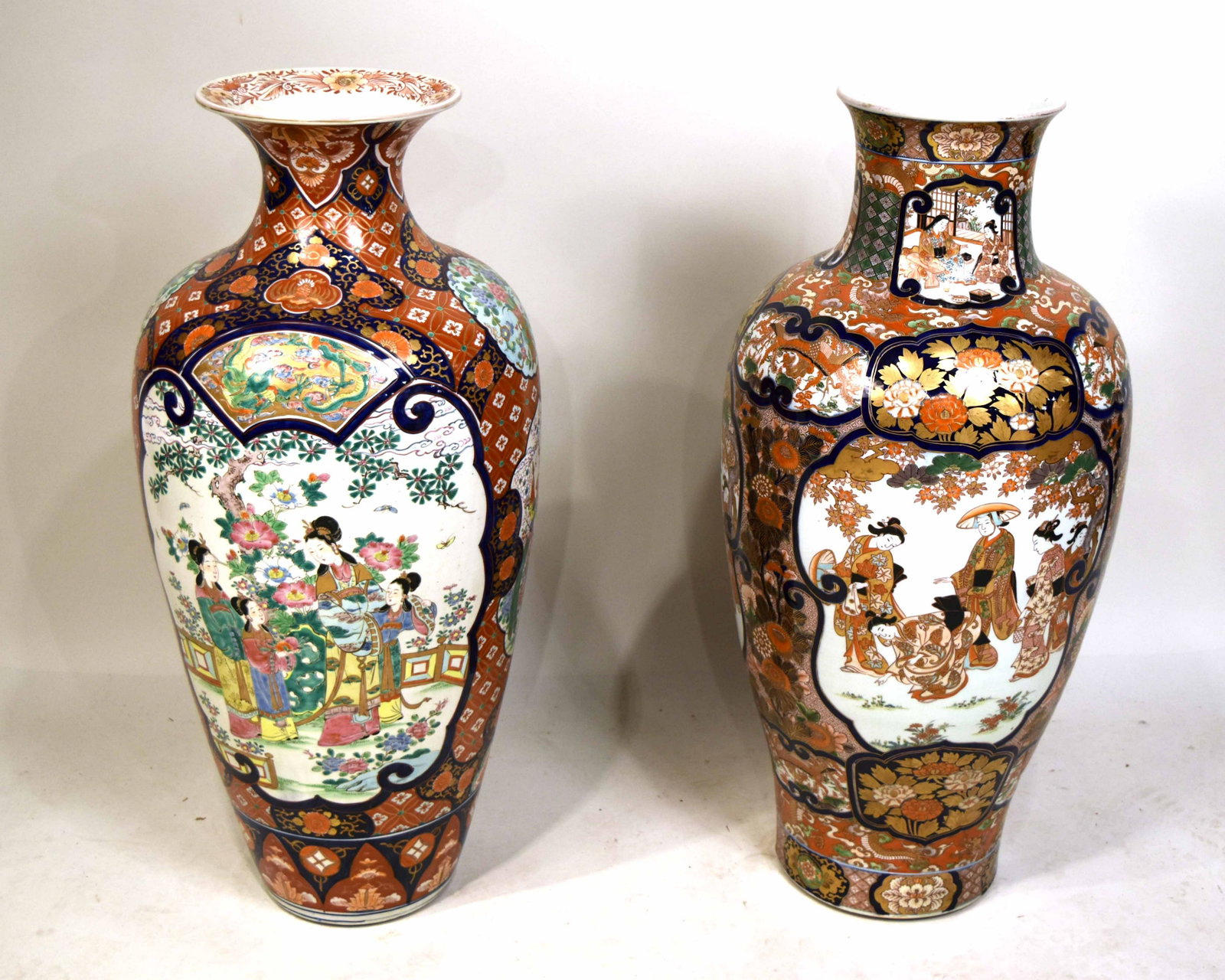 Two Similar Japanese Imari Pattern Floor Vases: 20th C., with folding hardwood stands. 36-1/2"h