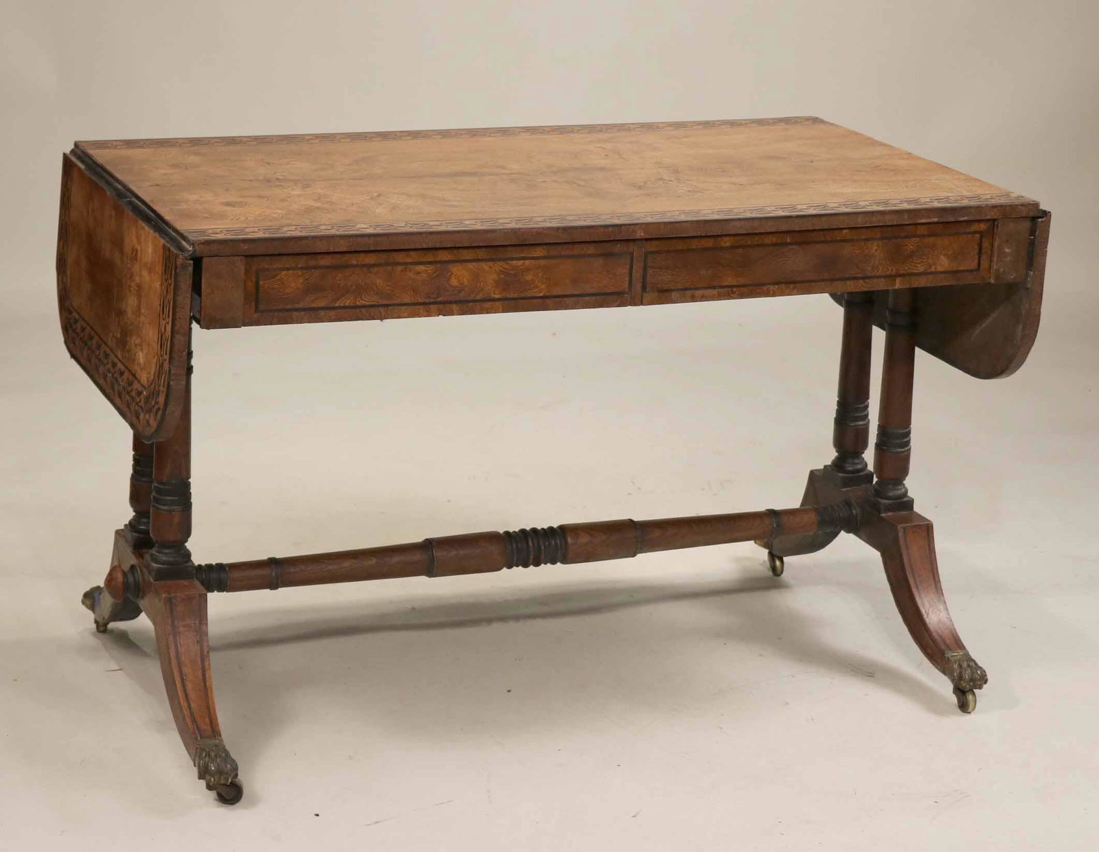 Regency Inlaid and Figured Oak Sofa Table: English, early 19th C. Imperfections to top, surface distressed, some losses to inlay. 28-1/2"h x 47"w (closed) x 25"d Provenance: Christie's, New York, April 6, 2000, $46,000.