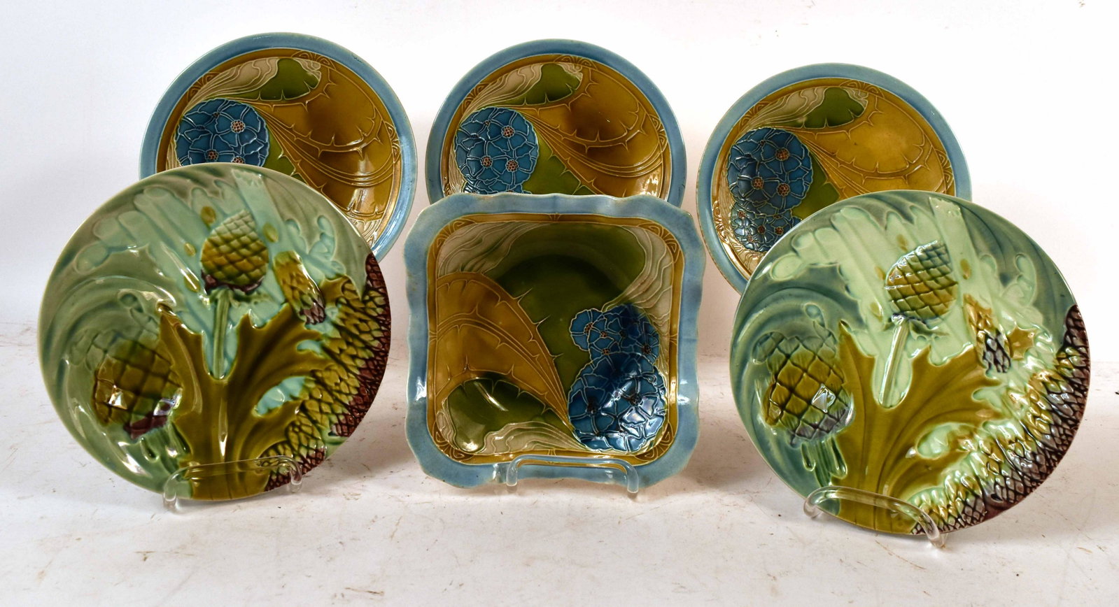 Pair of K.G. Luneville Majolica Asparagus Plates: French. Together with a partial Majolica dessert service, marked Minton, comprising three plates and a bowl. Luneville Plates: 9"dia. Minton Plates: 9"dia.