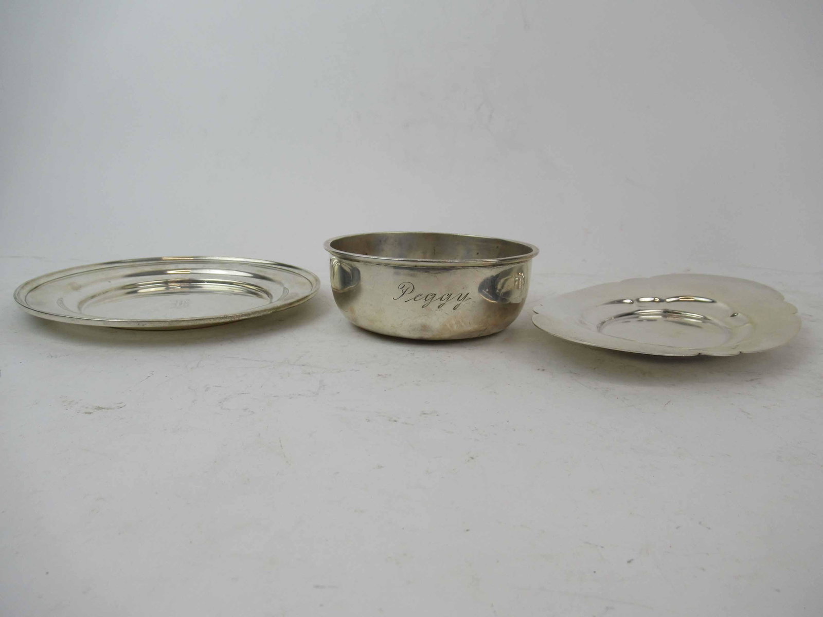Group of Assorted Sterling Silver Table Articles: Group of Assorted Sterling Silver Table Articles. Including, porringer, plate and tray. 11 t.o. Used condition, wear, worn, dents.
