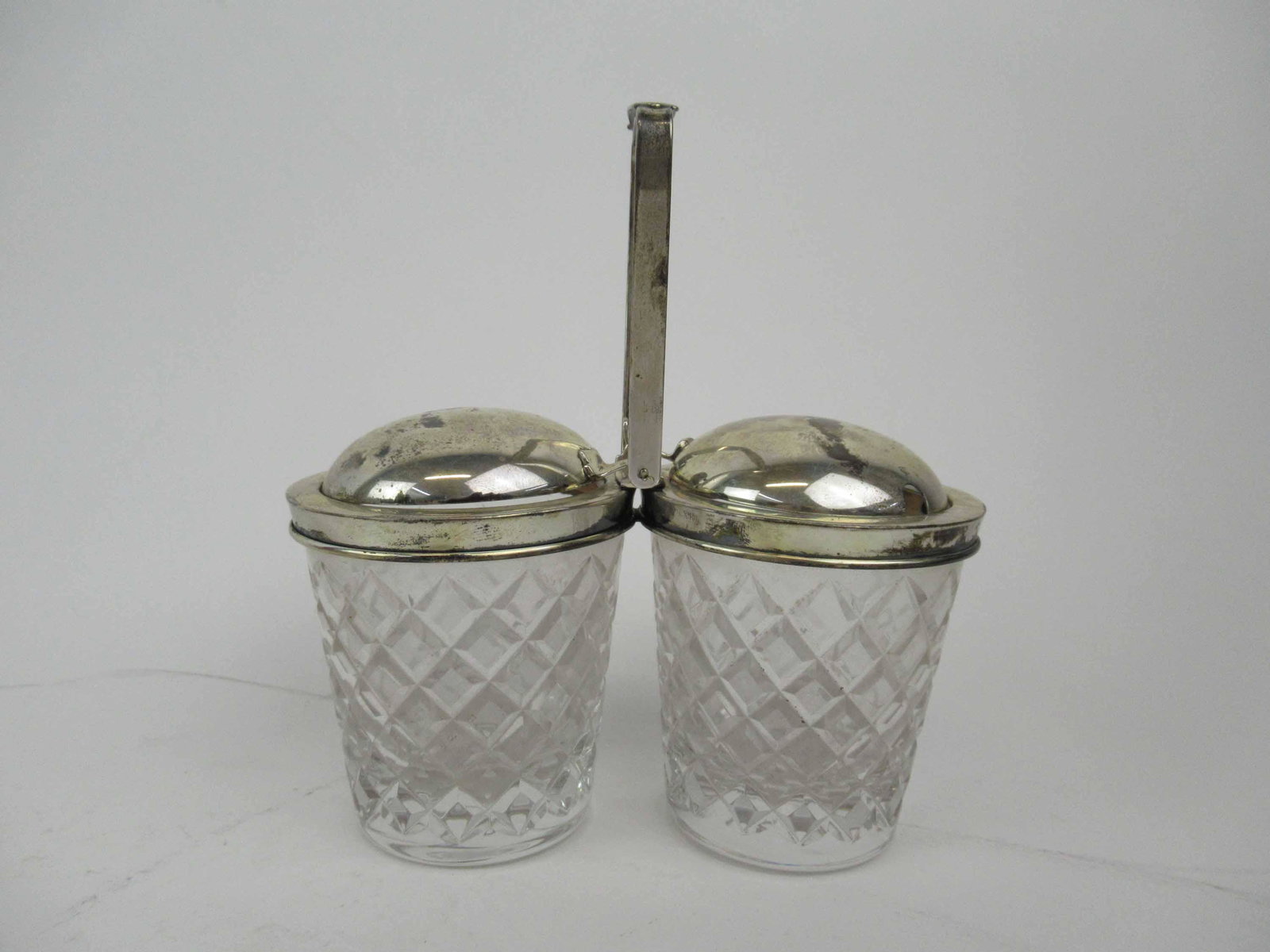 Cartier Sterling Silver Double Jam Server: Cartier Sterling Silver Double Jam Server mounted on crystal pots. Used condition, wear, marked Cartier sterling. 6 1/2" tall X 6 1/4" wide.