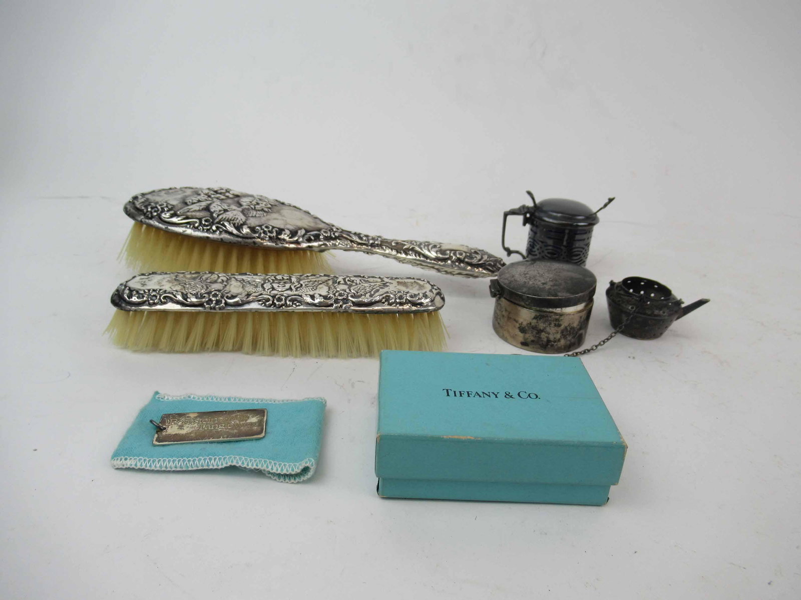Broadway and Co English Silver Brush Set: Broadway and Co English Silver Brush Set. Together with Nathan and Hayes Mustard pot, Tiffany and Co sterling silver charm,Sterling silver tea strainer and Sterling silver stamp case with monogrammed.