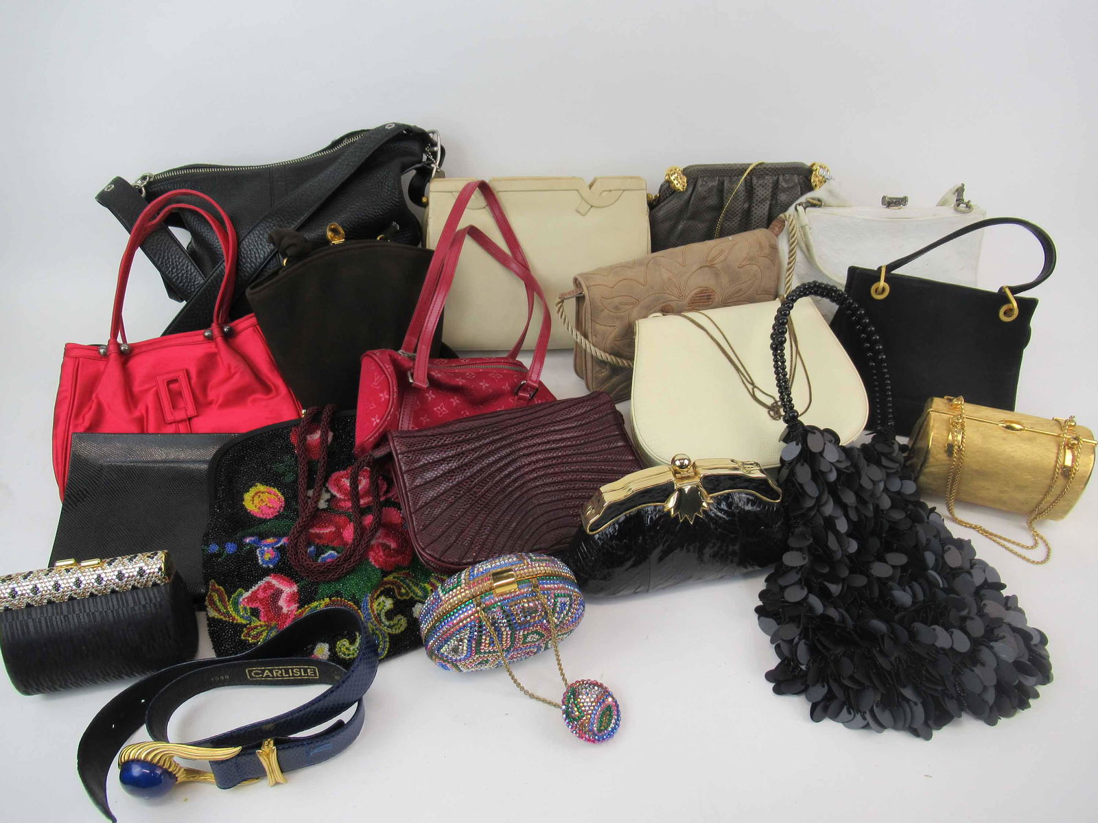 A Group of Assorted Ladies Purses and Bags: A Group of Assorted Ladies Purses and Evening Bags. Including Names like Sasha, Bonwit Tellar, Ashneil, Coach, Louis Vuitton, Charles Gourdan and Renaud Pellegrino. We believe some of these items are