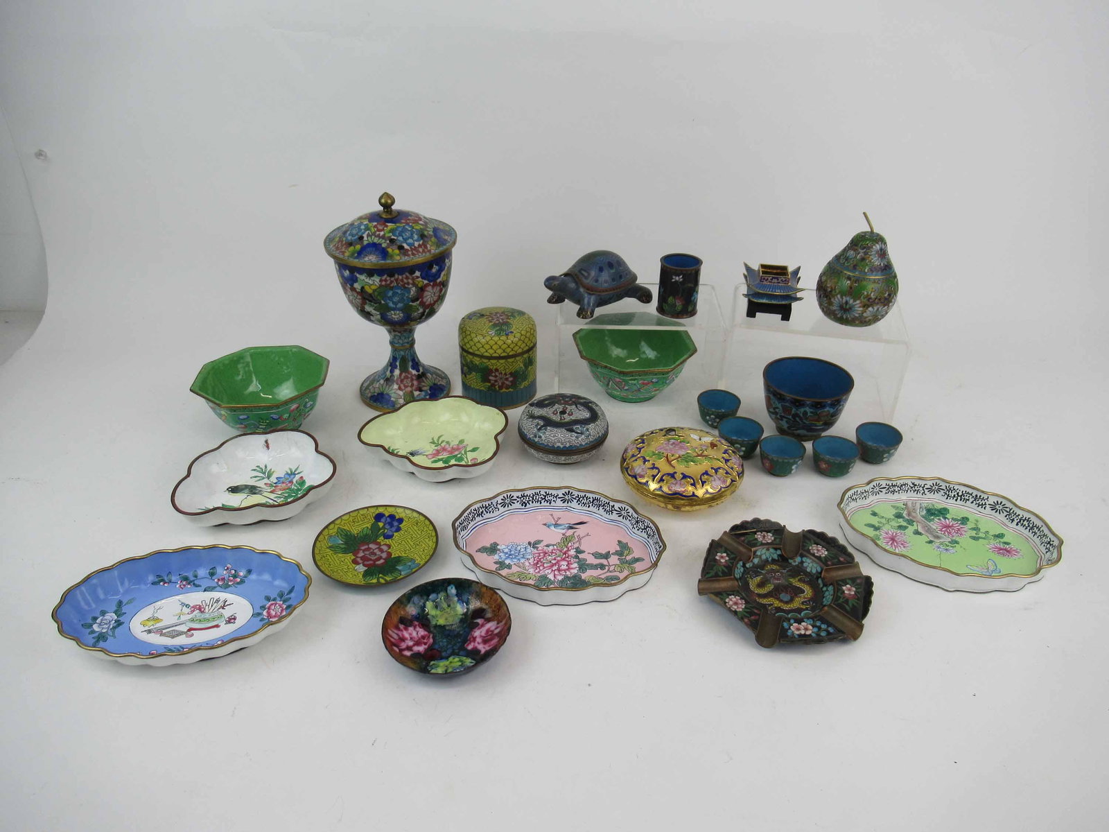 Group of Assorted Asian Enamelware Cloisonne: Group of Assorted Asian Enamelware Cloisonne table articles. Including dragon box, pear, turtle, chalice and bowls. Used condition, wear, worn.