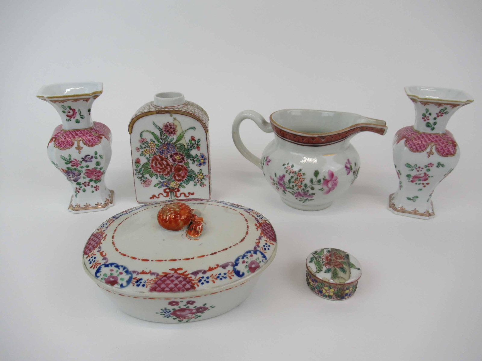 Group of Assorted Chinese Export Table Articles: Group of Assorted Chinese Export Table Articles with floral design. Including tea caddy, creamer, pair of vases and covered dish. Used condition, dish has chip to rim and lid, one vase has chip to rim