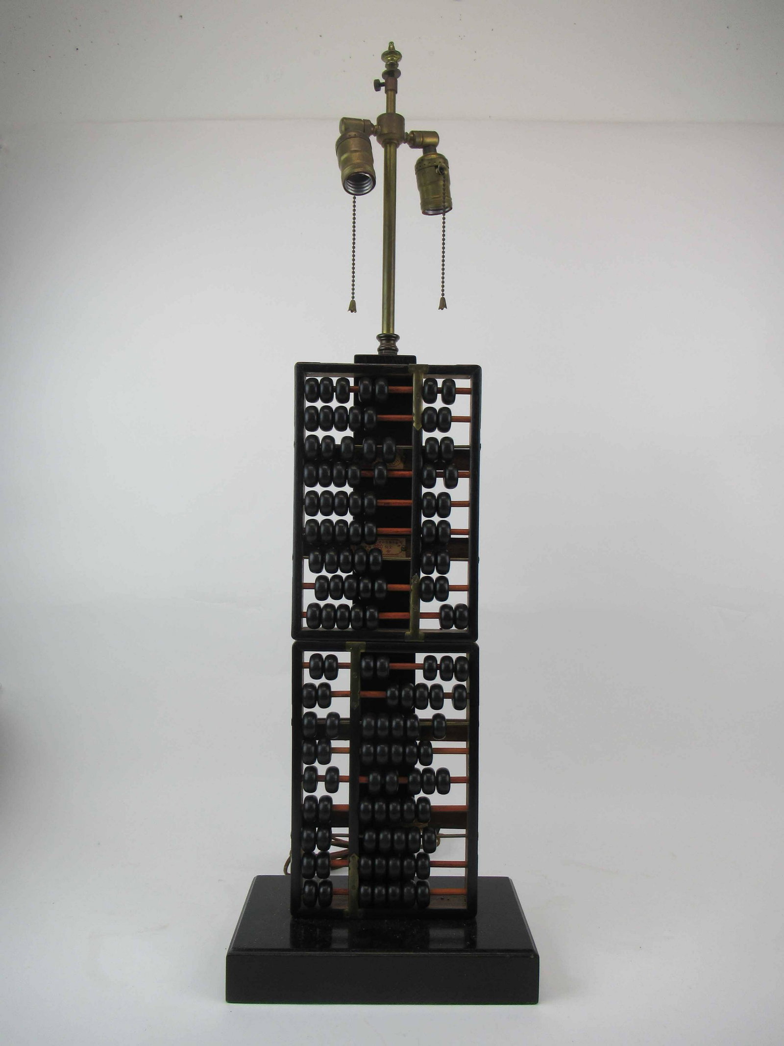Chinese Abacus Wooden Table Lamp: Chinese Abacus Wooden Table Lamp mounted on wood base. Used condition. 35 1/4" tall x 11" wide x 5 3/4" deep.