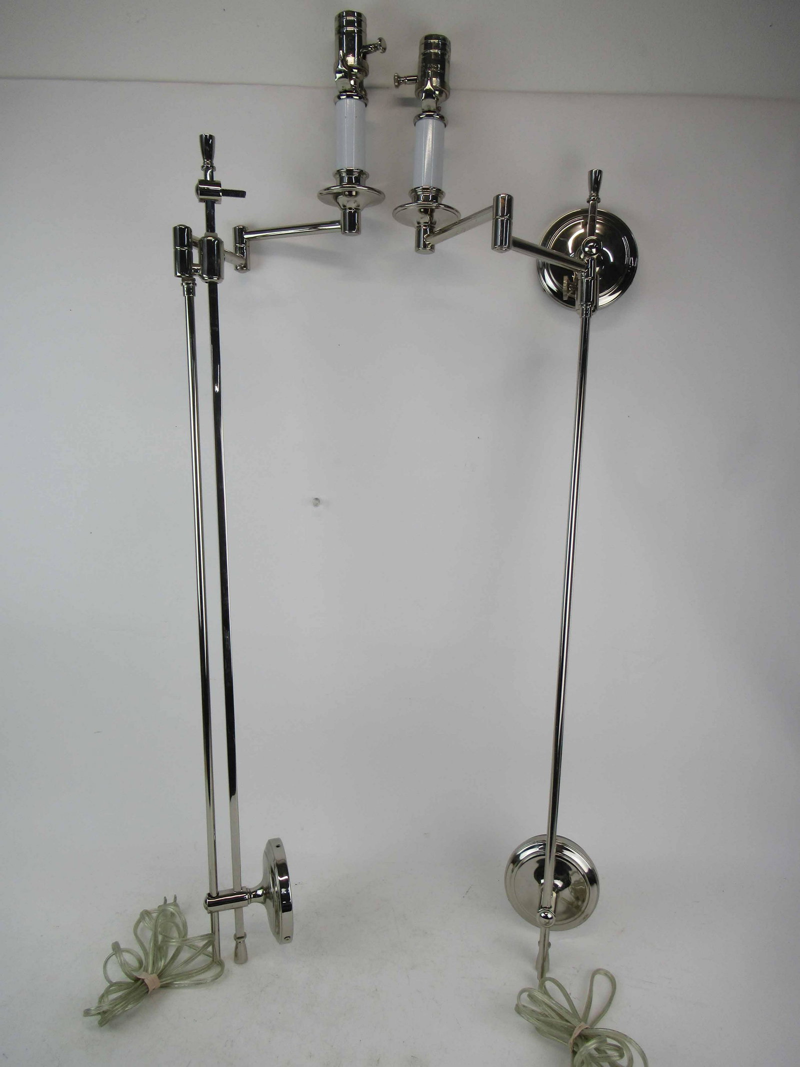 Pair of Modern Chrome Adjustable Wall Sconces: Pair of Modern Chrome Adjustable Wall Sconces. Used condition, one has damage and missing pieces. 41 1/2" tall