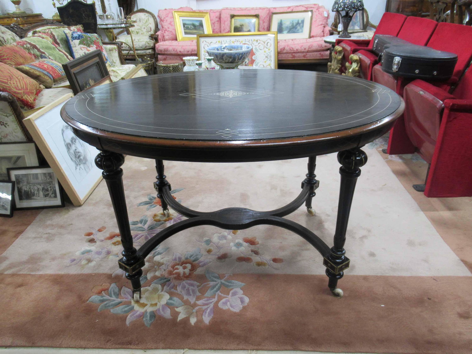 Antique Ebonized Brass Mounted Center Table: Antique Ebonized Brass Mounted Center Table with Central bone inlaid top. Used condition. Late 19th C. 48" long x 35 1/2" x 28 3/4" tall