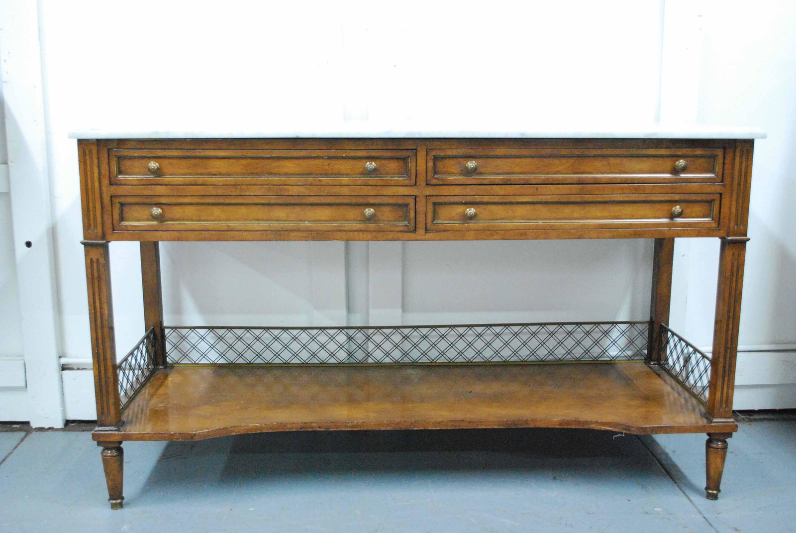 Neoclassical Style Walnut Marble Top Console Tabl: Neoclassical Style Walnut Marble Top Console Table. Having four drawers over a shelf with brass gallery. Used condition, wear, worn, crack to wood. 32" tall x 54" long x 19" wide Condition: Used.