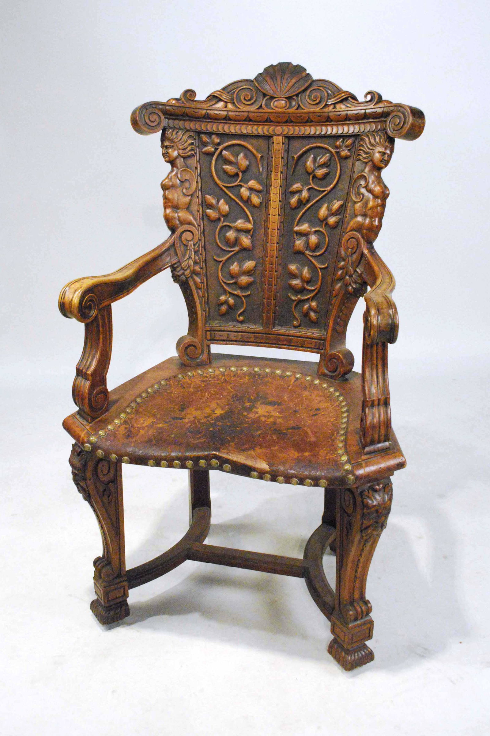 Baroque Style Carved Walnut Armchair: With leather seat, very distressed. 43-1/2"h