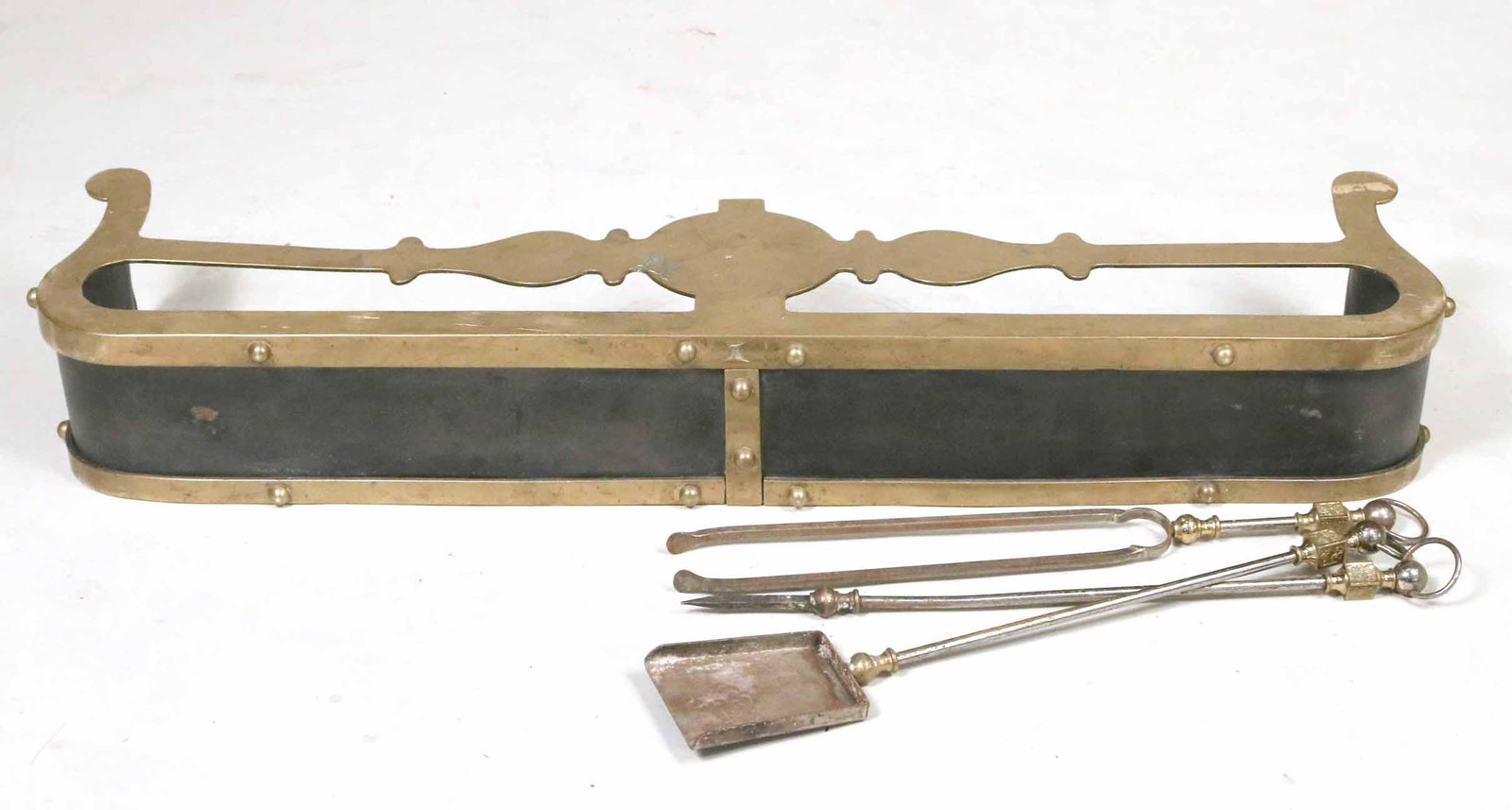 Armour Style Brass and Metal Fender: Armour Style Brass and Metal Fender Together with three steel and brass fire tools, comprising, tongs, poker and shovel. Fender: 10-1/2"h x 48"w x 7"d
