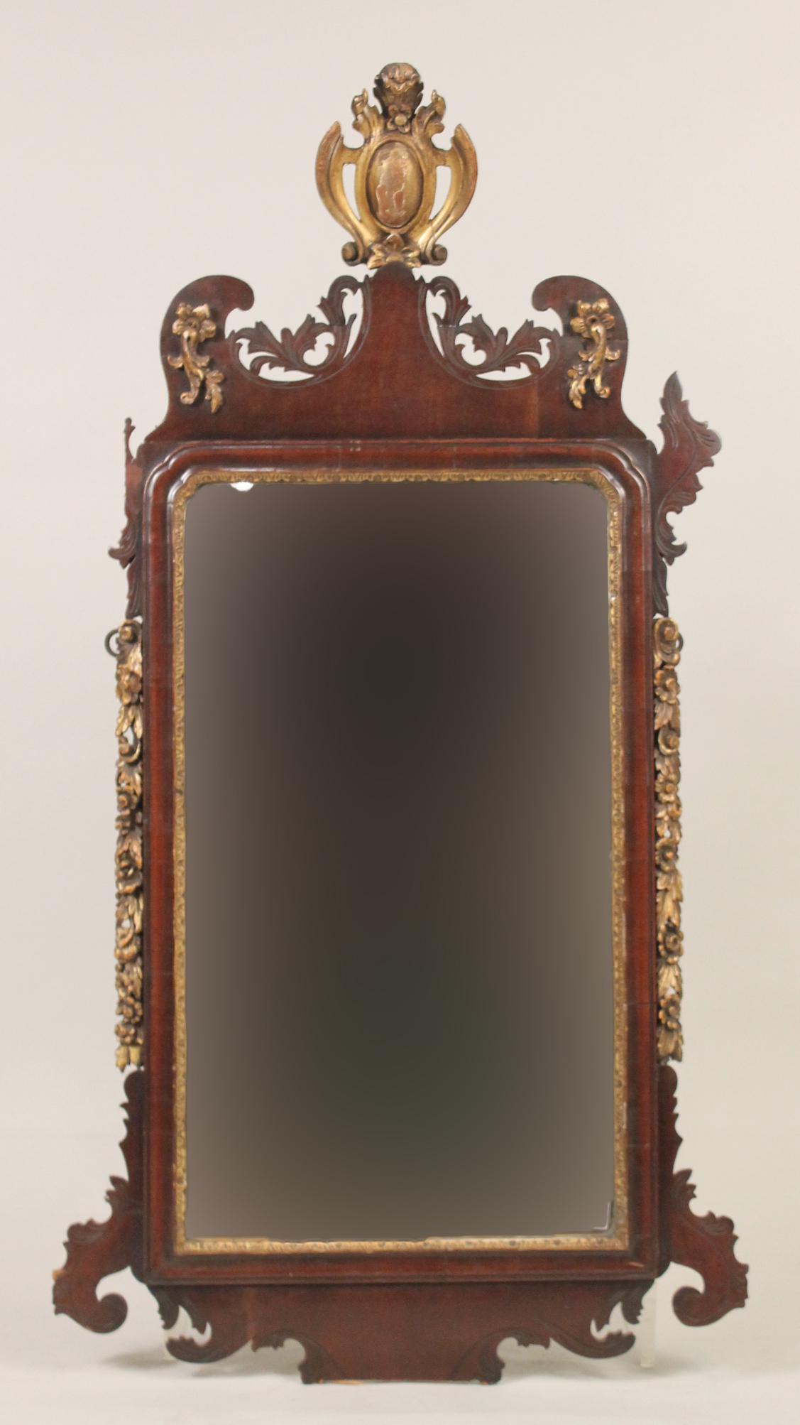 Rococo Parcel-Gilt Mahogany Mirror: Baltic, c. 1780. Lacking bottom crest, upper left ear, and some gilt. 47"h x 25-1/2"w