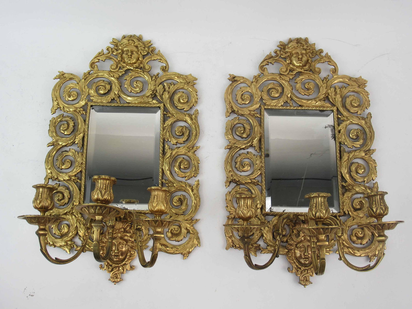 Pair of Victorian 3 Light Wall Sconces: Pair of Victorian 3 Light Mirrored Back Wall Sconces. Each having a central beveled mirror. Used condition, wear, worn. 18 1/2" tall x 10 1/2" wide x 6 3/4" deep