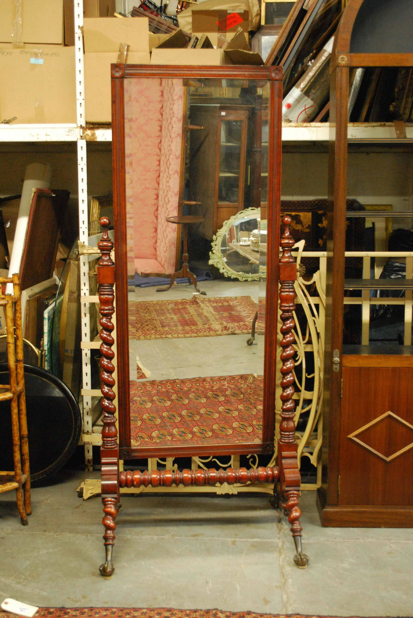Antique Mahogany Cheval Mirror: Antique Mahogany Cheval Mirror with barley twist arms and beveled glass resting on ball and claw feet. Used condition, 75" tall x 32" wide x 24 1/2" deep