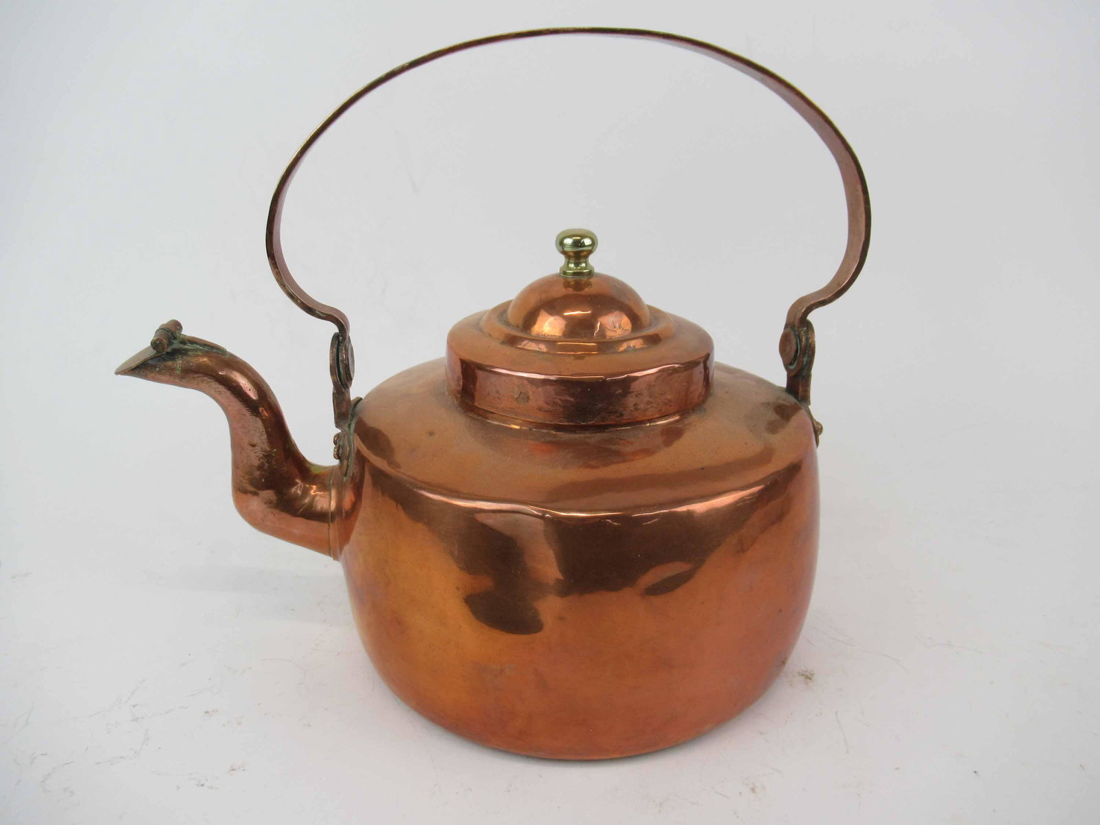 Antique Copper Hot Water Kettle.: Antique Copper Hot Water Kettle. Having dovetailed base and side. Copper rivets and makers on top of handle. Used condition, dents, cut to interior rim. 11 1/2" tall to top of handle when up x 14 1/4 