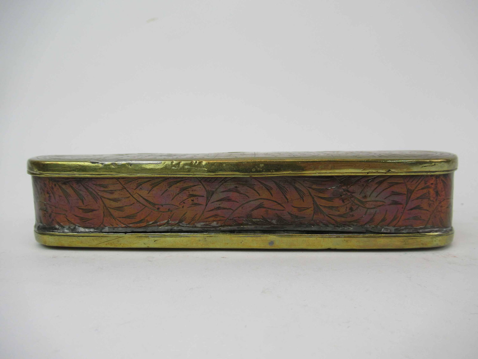 Antique Dutch Brass and Copper Tobacco Box: Antique 18th c Dutch Brass and Copper Tobacco Seamans Box with a perpetual calendar. The box with rounded end and a hinged lid, the top engraved with Julius Caesar, above 45 BC, the date of the introd