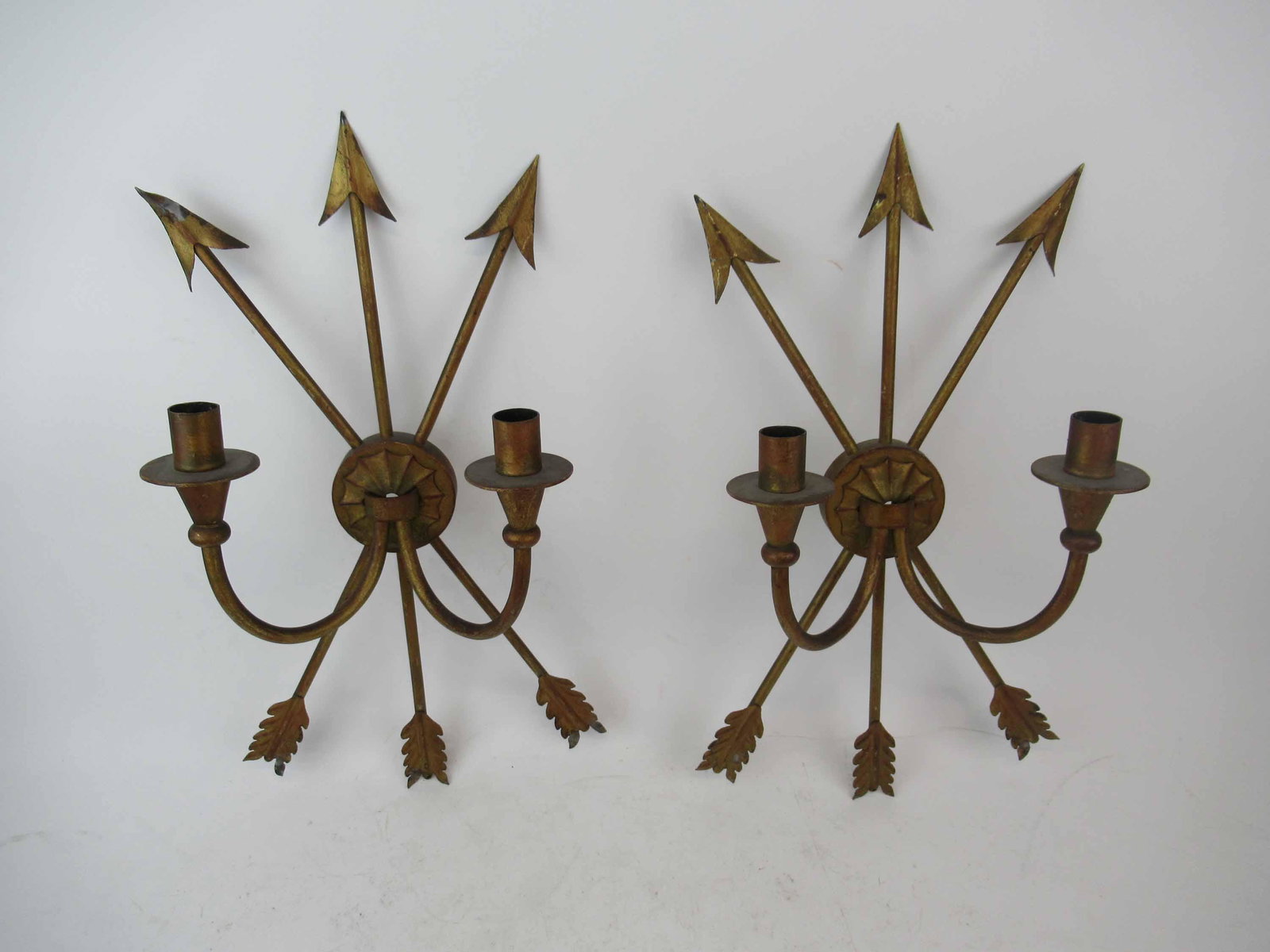 Pair of 2 Light Gilt Metal Wall Sconces: Pair of 2 Light Gilt Metal Wall Sconces with crossed arrow decoration. Used condition, wear, worn, paint losses, bends. 19" height x 11" wide x 5 1/2" deep