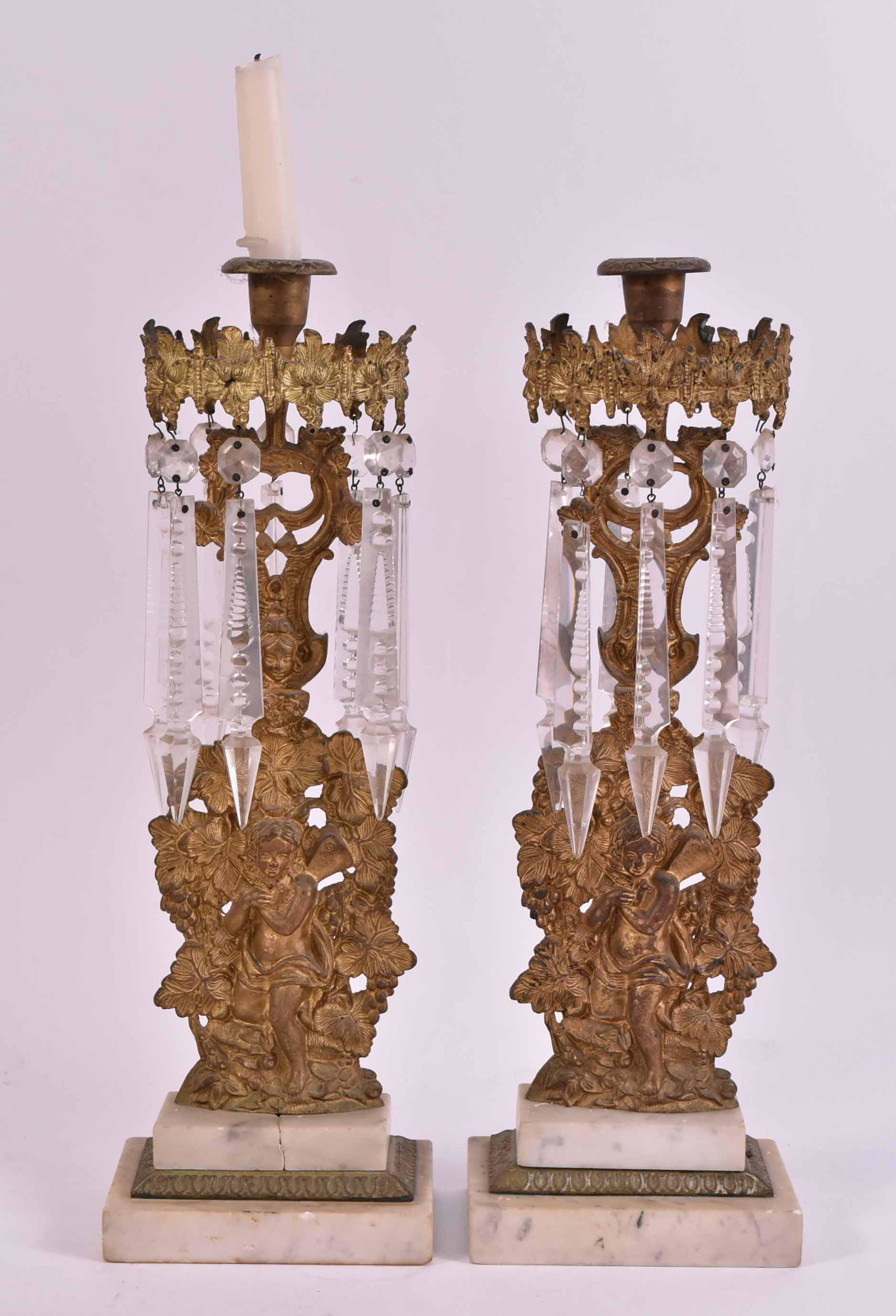 Pair of Gilt-Metal and Marble Girandoles: 19th/20th C. with cherub standards. Some crystals lacking, chips, cracks to marble. 16-1/2"h x 5-1/2"w x 3-1/2"d