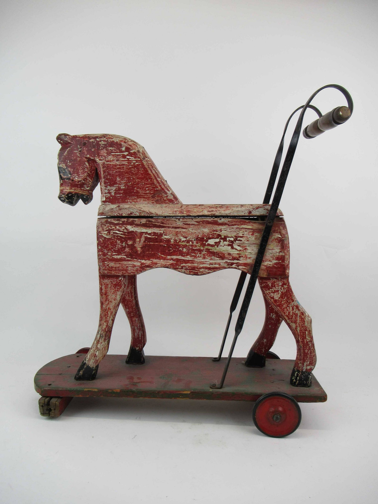 Vintage Child's Wooden Horse Push Toy: Vintage Child's Wooden Horse Push Toy with red painted horse. Used condition, wear, worn, missing wheel, paint losses. 22" long x 23 1/2" tall x 8 1/2" wide.