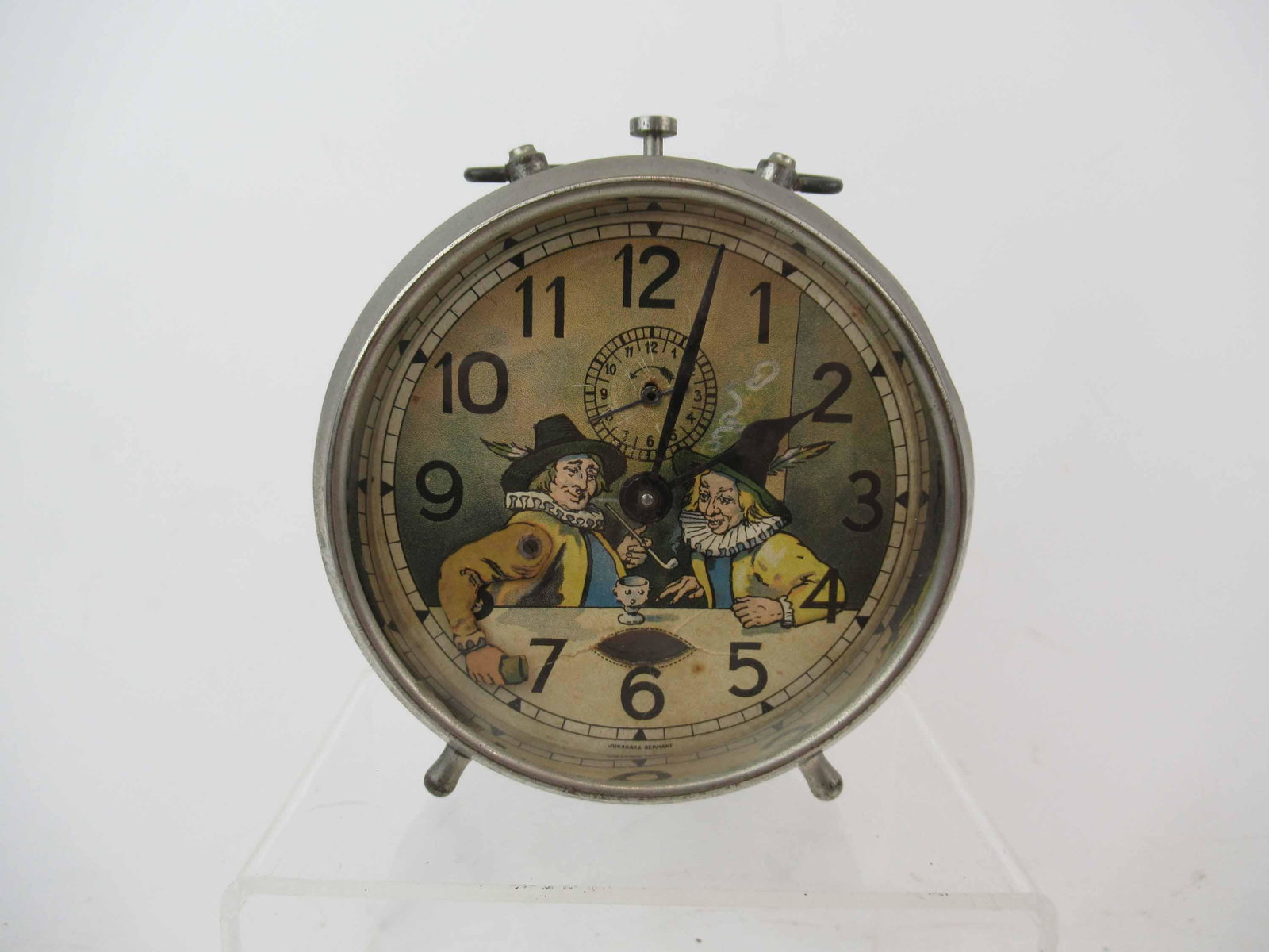 Rare Junghans Mechanical Alarm Clock: Rare Junghans Mechanical Alarm Clock. Alarm clock with mechanised dice throwers on dial, made by Junghans, Wurtemberg, Germany. Used unknown working condition. 5 1/2" Tall X 5 1/4"