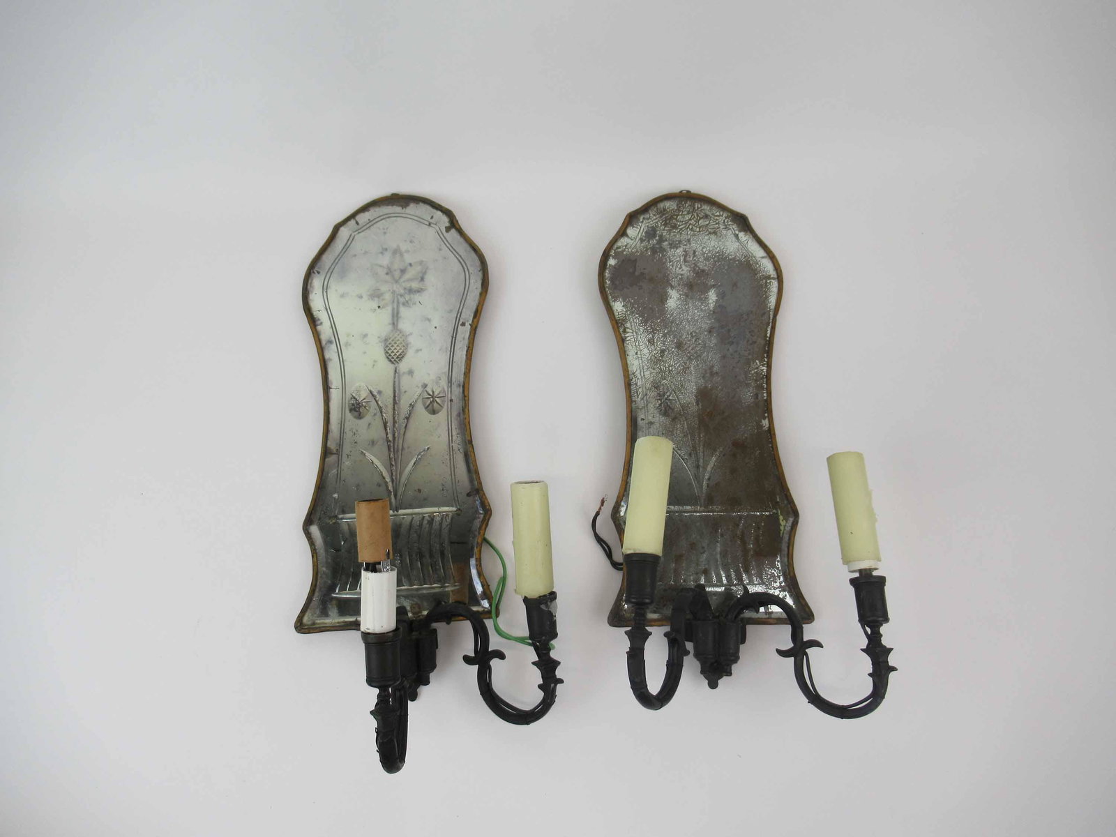 Pair of Mirrored Back Wall Bronze Wall Sconces: Pair of 2 light Mirrored Back Wall Bronze Wall Sconces. Each having an etched and beveled mirror. Used condition, wear, worn, broken sconce needs to be reattached. 16 3/4" tall. 7 3/4" wide x 4 3/4" d