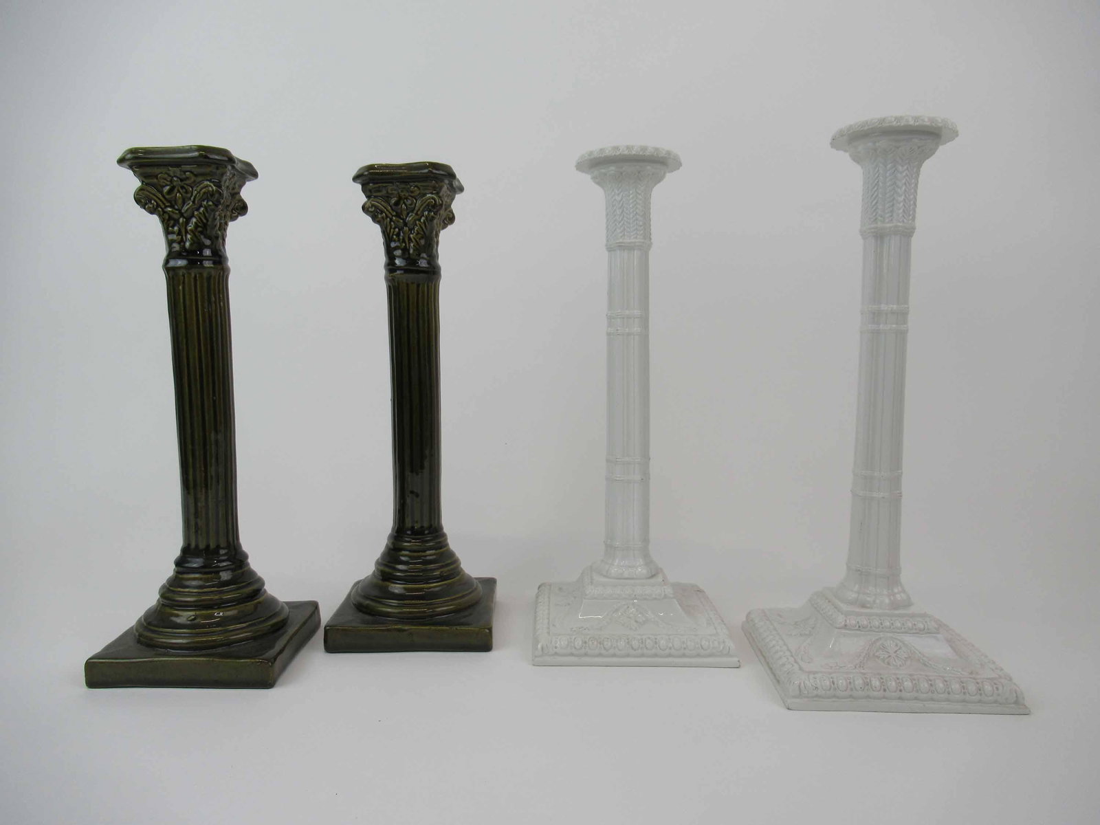 Classical Form Candlesticks: Pair of Mottahedeh Design Italy Classical Form Candlesticks. Together with a pair of Green Faience style candlesticks. Used condition, minor chips to green candlesticks. 12 1/4" x 4 3/4" Diameter