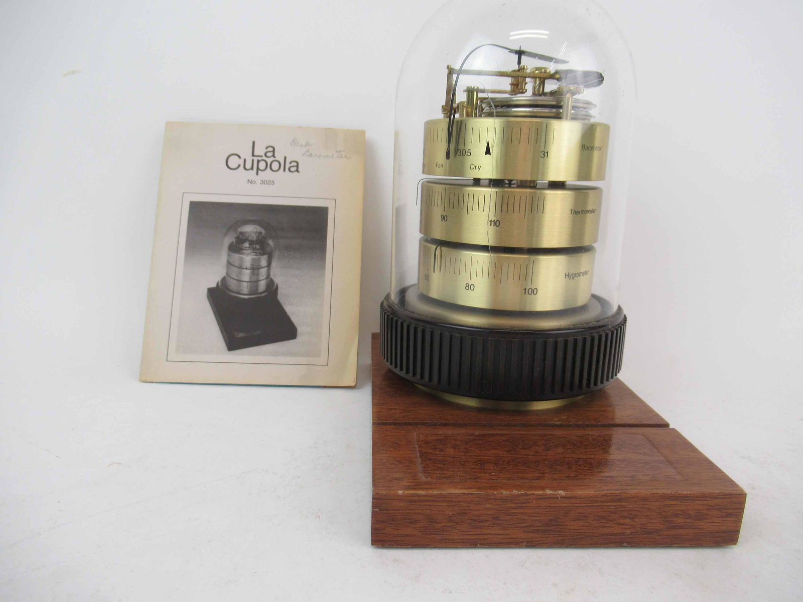 La Cupola Brass Barometer Thermometer Hygrometer: La Cupola Brass Barometer Thermometer Hygrometer weather instrument, Benchmark made in Germany. Used condition, unknown working condition, crack to dome. 6 1/4" x 4 1/2" x 7 1/2" tall