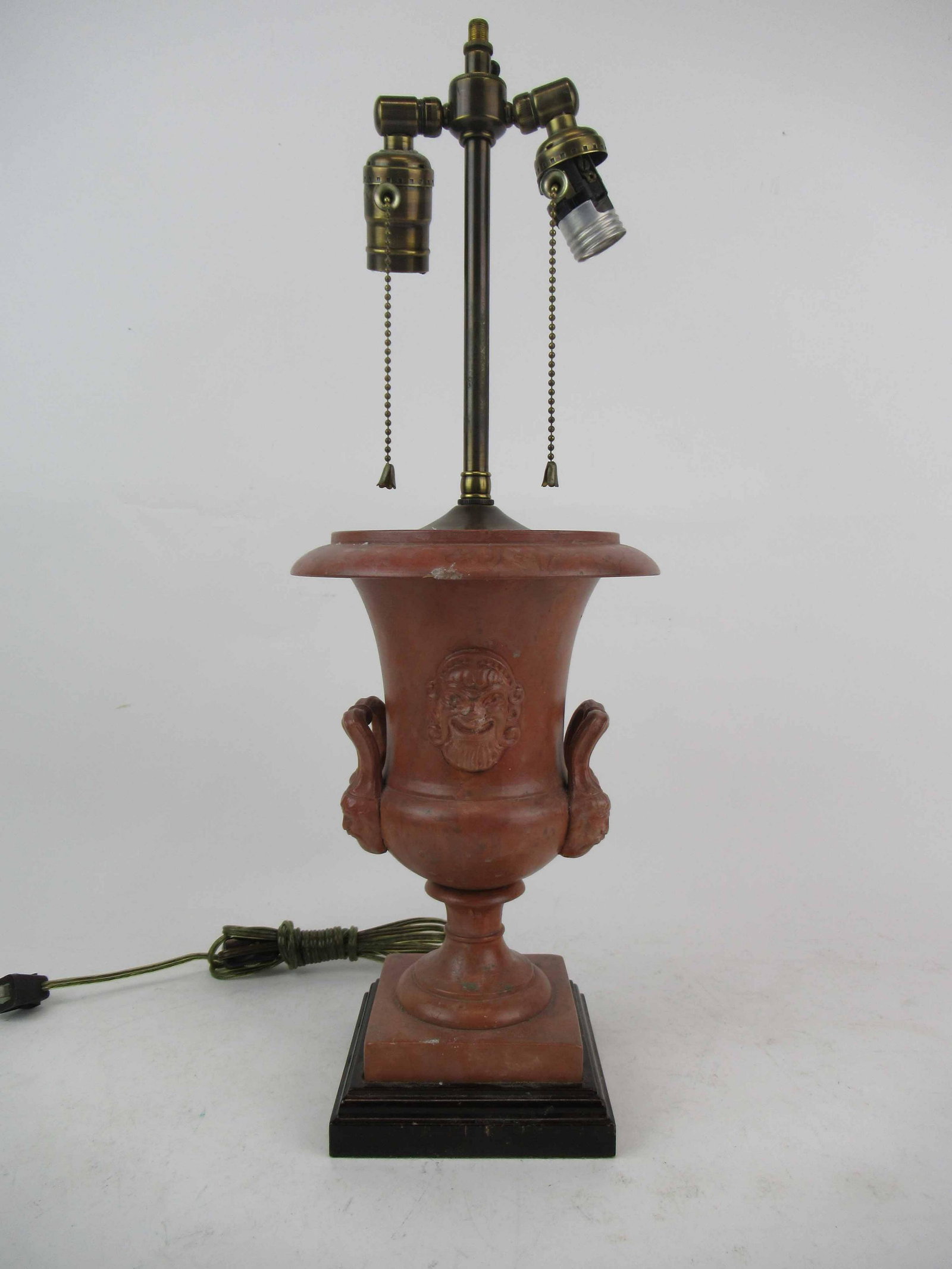 Earthenware Double Handled Urn: Earthenware Double Handled Urn with masked handles, mounted as a lamp. Used condition, wear, worn, chips. 21" tall x 7 1/2" diameter.