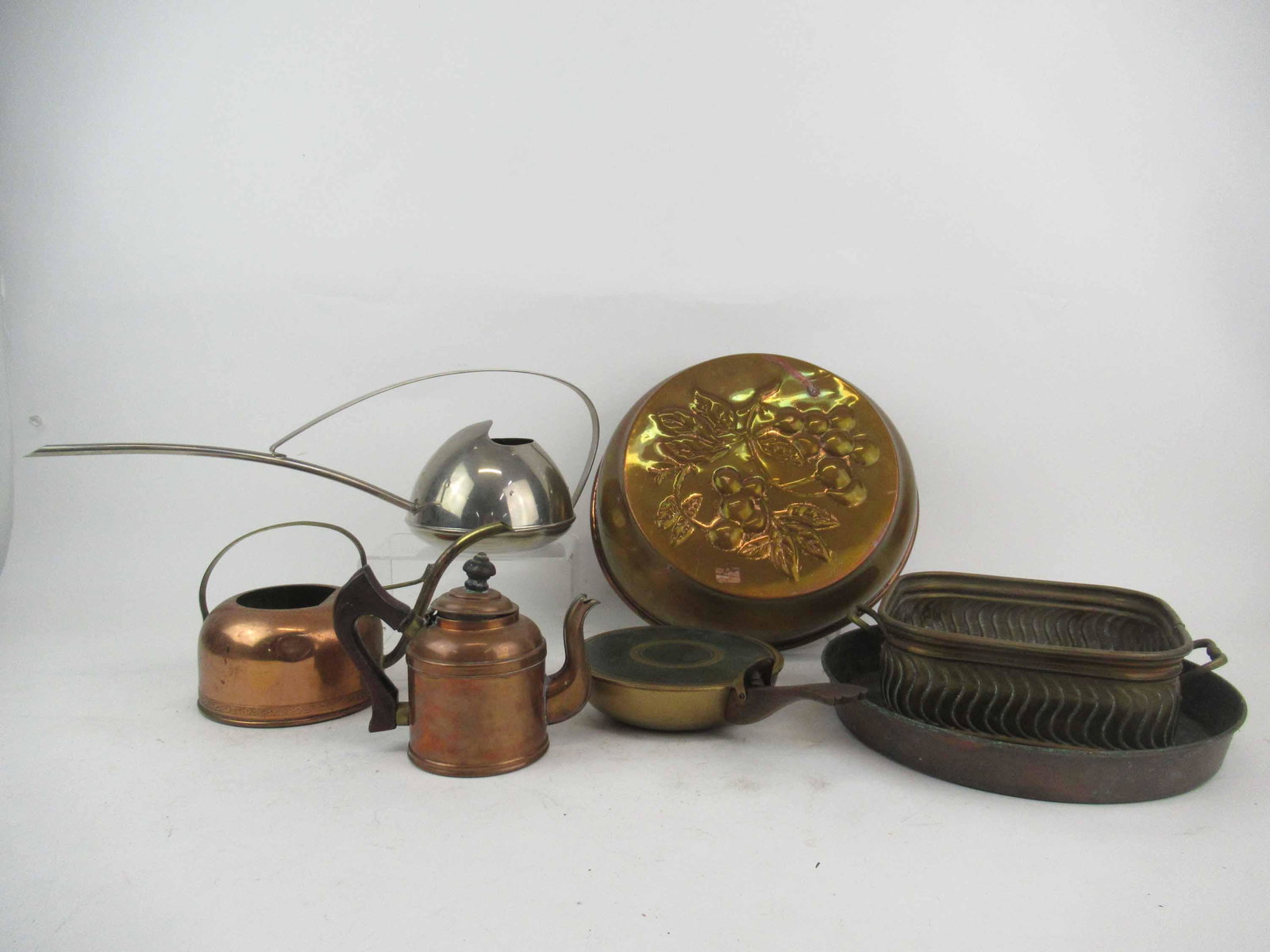 Group of Assorted Copper Table Articles: Group of Assorted Copper Table Articles. Including Swedish Cherry Bread mold 11 1/2" diameter x 3" tall, watering can, tea pot, pan, Grammer pan, copper basket and German watering can. Used condition,