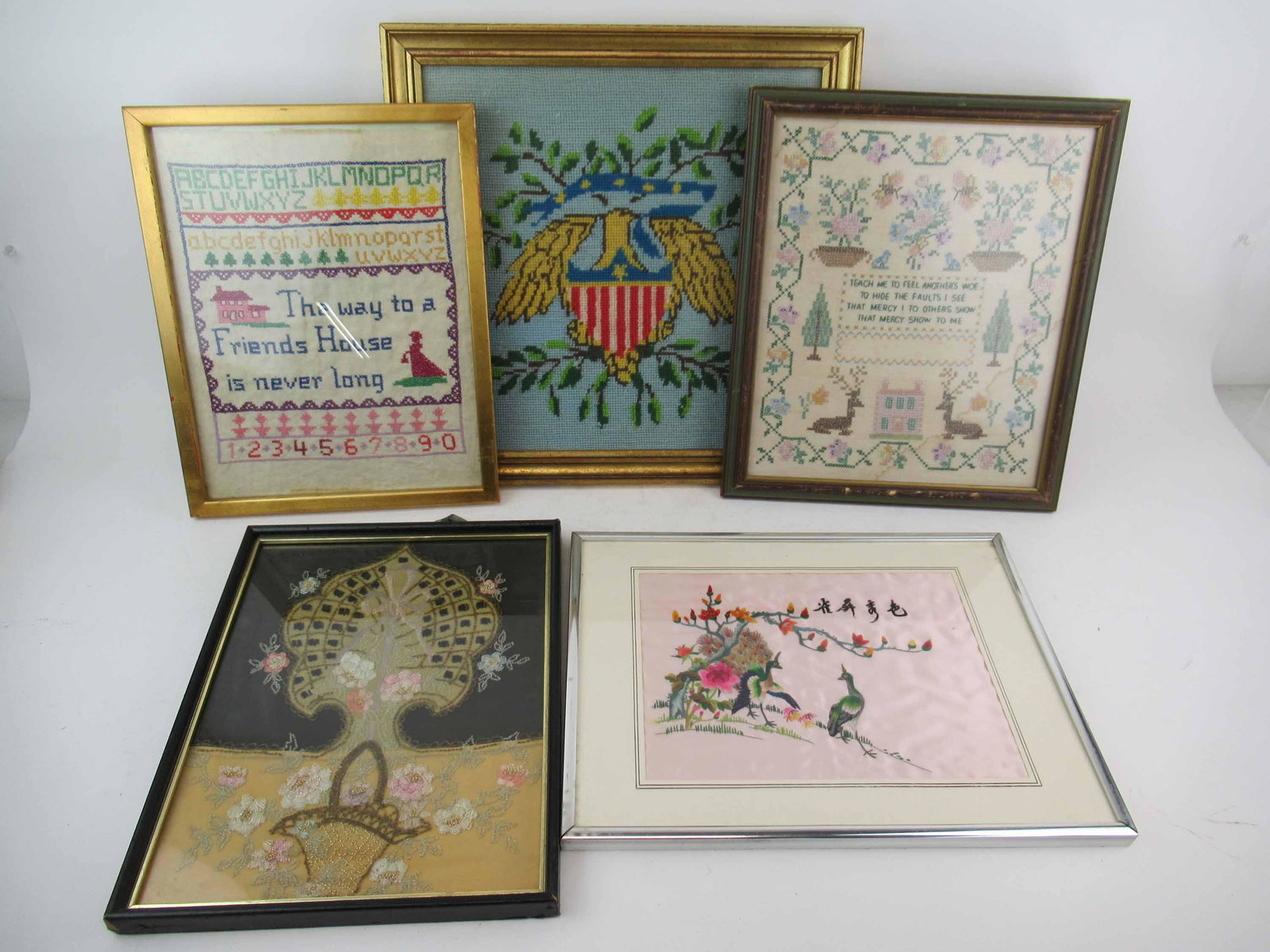 Group of Assorted Framed Needleworks: Group of Assorted Framed Needleworks including samplers, eagle, peacocks. Used condition, wear, worn. largest 17" x 17