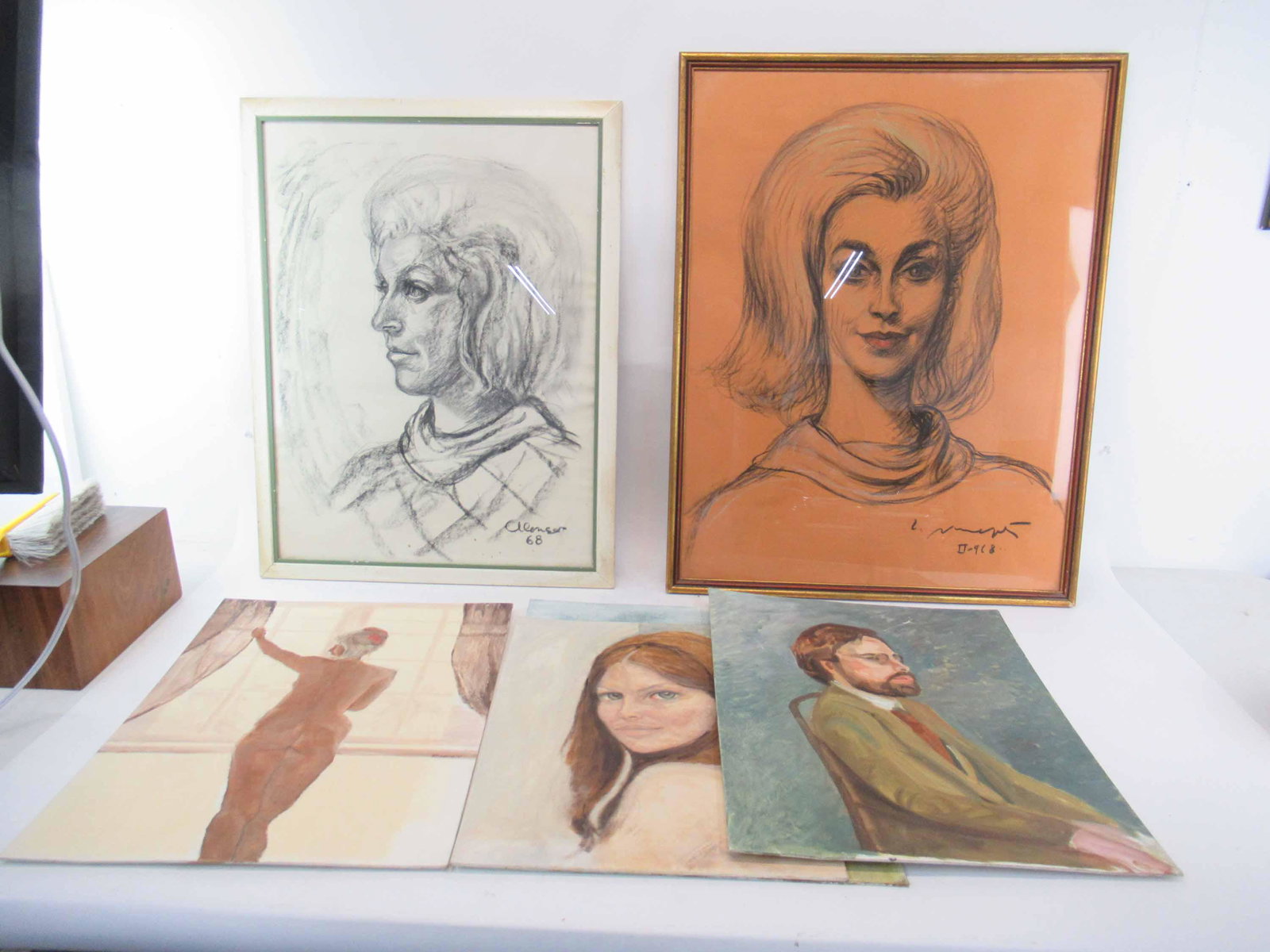 Three Assorted Mixed Media Family Portraits: Three Assorted Mixed Media Family Portraits one of gentleman signed lower right Lois Amida Miller two on of females, singed illegibly. Together with 4 additional assorted portraits on canvas board. Us