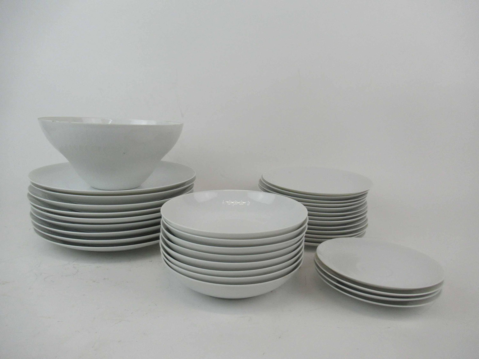 Rosenthal Romance Partial Dinnerware Service: Rosenthal Romance Partial Dinnerware Service. Comprising of 9 dinner plates 10 1/4" - 2 with chips, 13 salad plates, 8 soup bowls, one serving bowl and four saucers with - one with hairline. Used cond