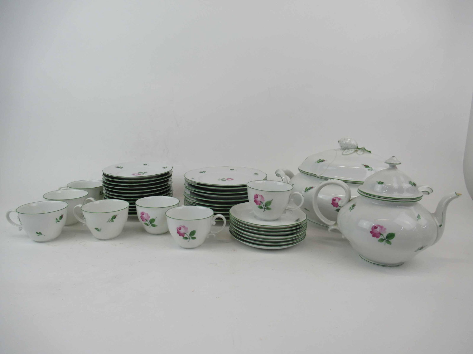 Augarten Viennese Rose Partial Porcelain Set: Augarten Viennese Rose Partial Porcelain Set. Including 10 salad plates 7 3/4" diameter, 12 bread and butter, 7 cups and saucers one has chip to rime, tureen has chips, repairs and breaks and tea pot 