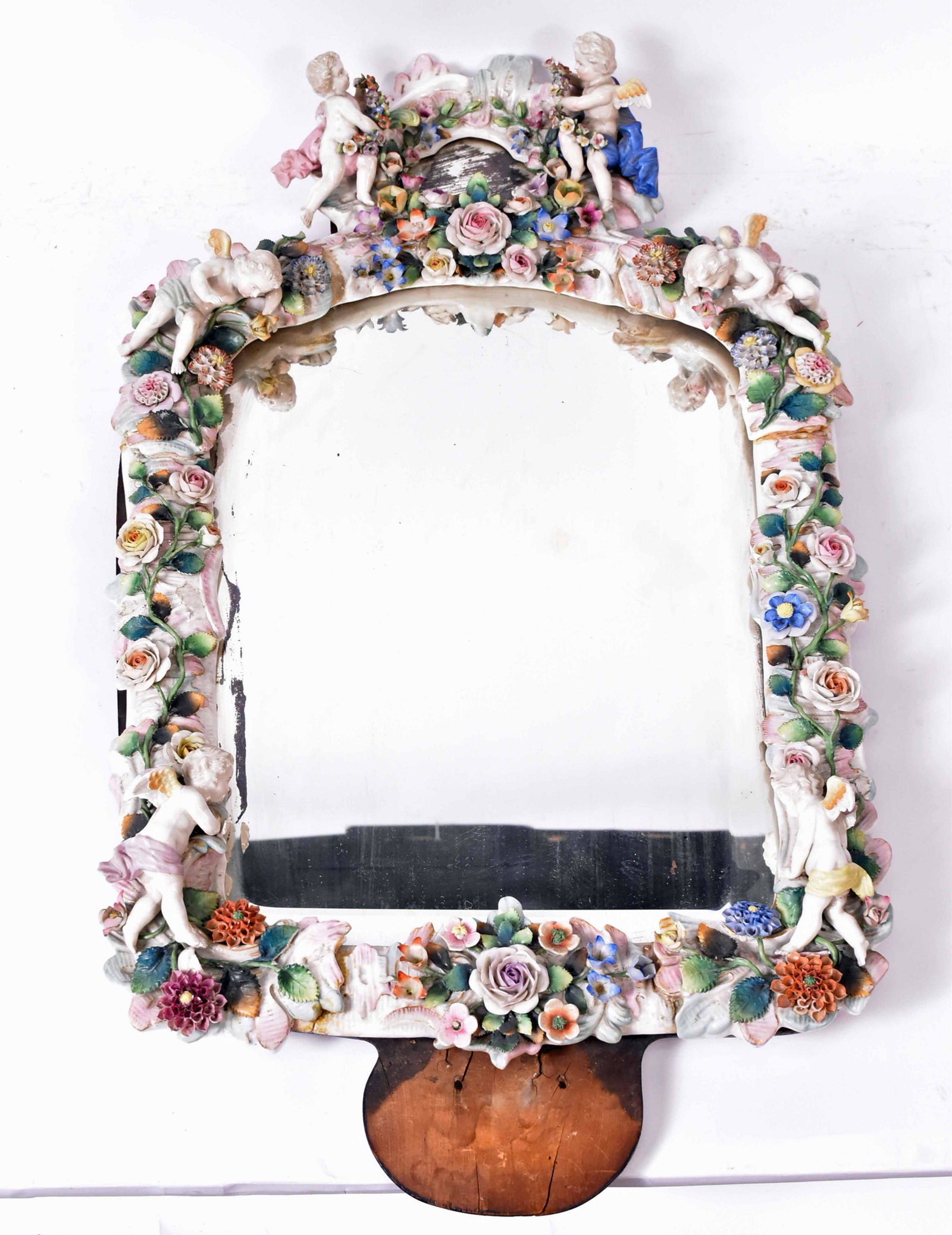 Stzendorf Putti Decorated Porcelain Mirror: Crossed sword mark. Losses and cracks. 30"h x 16"w