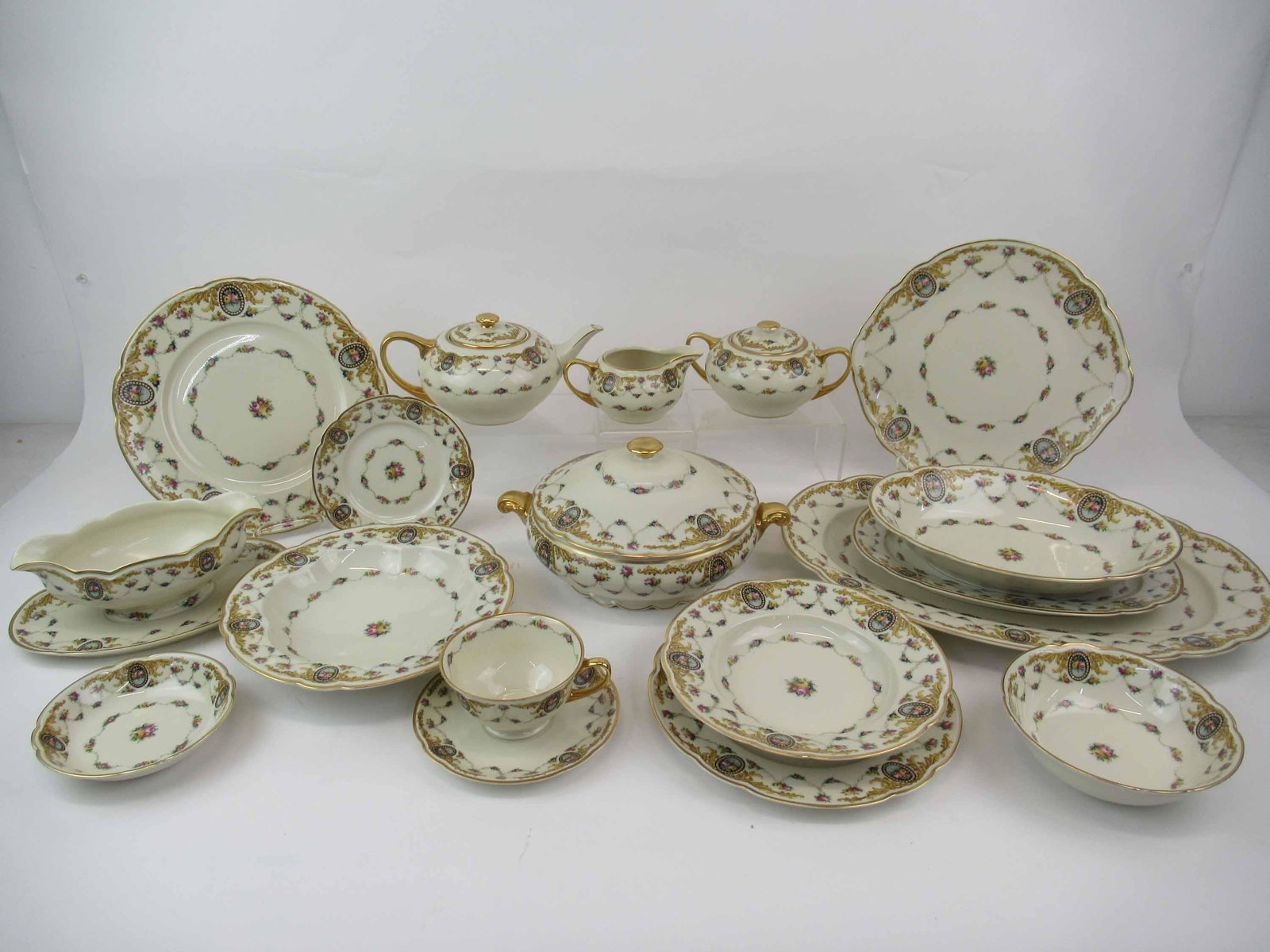 Black Knight Partial Dinnerware Service: Black Knight Partial Dinnerware Service. Comprising of 12 dinner, 12 luncheon, 12 bread and butter, 12 rimmed soup, 12 soup, 11 cereal, 12 fruit, tea pot, vegetable, cream and sugar, 8 cups 12 saucers