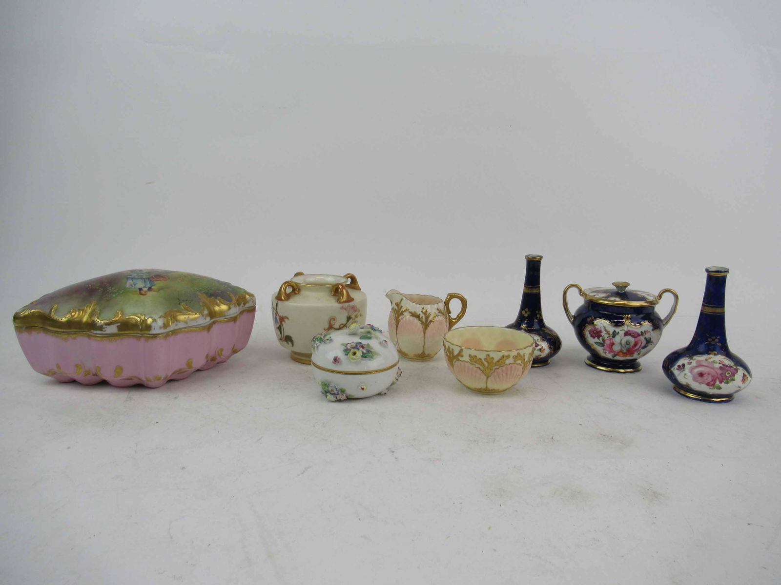 Group of Assorted Porcelain Table Articles: Group of Assorted Porcelain Table Articles. Including mini Coalport creamer and sugar. Meissen covered trinket dish cracked, Limoges porcelain dresser box with gilt losses 7 1/2" long x 6" wide x 4" t