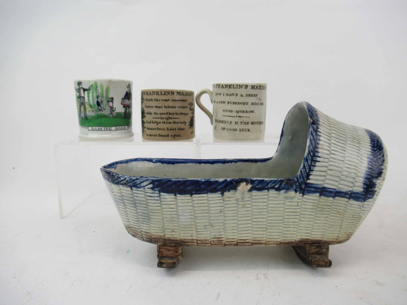 Three 19th c Staffordshire Child's Mugs: Three 19th c Staffordshire Child's Mugs. Including Doctor Franklin's Maxims and Dancing Dogs. Together with a Staffordshire Cradle. Used condition, wear, worn, staining, cracks, chips.