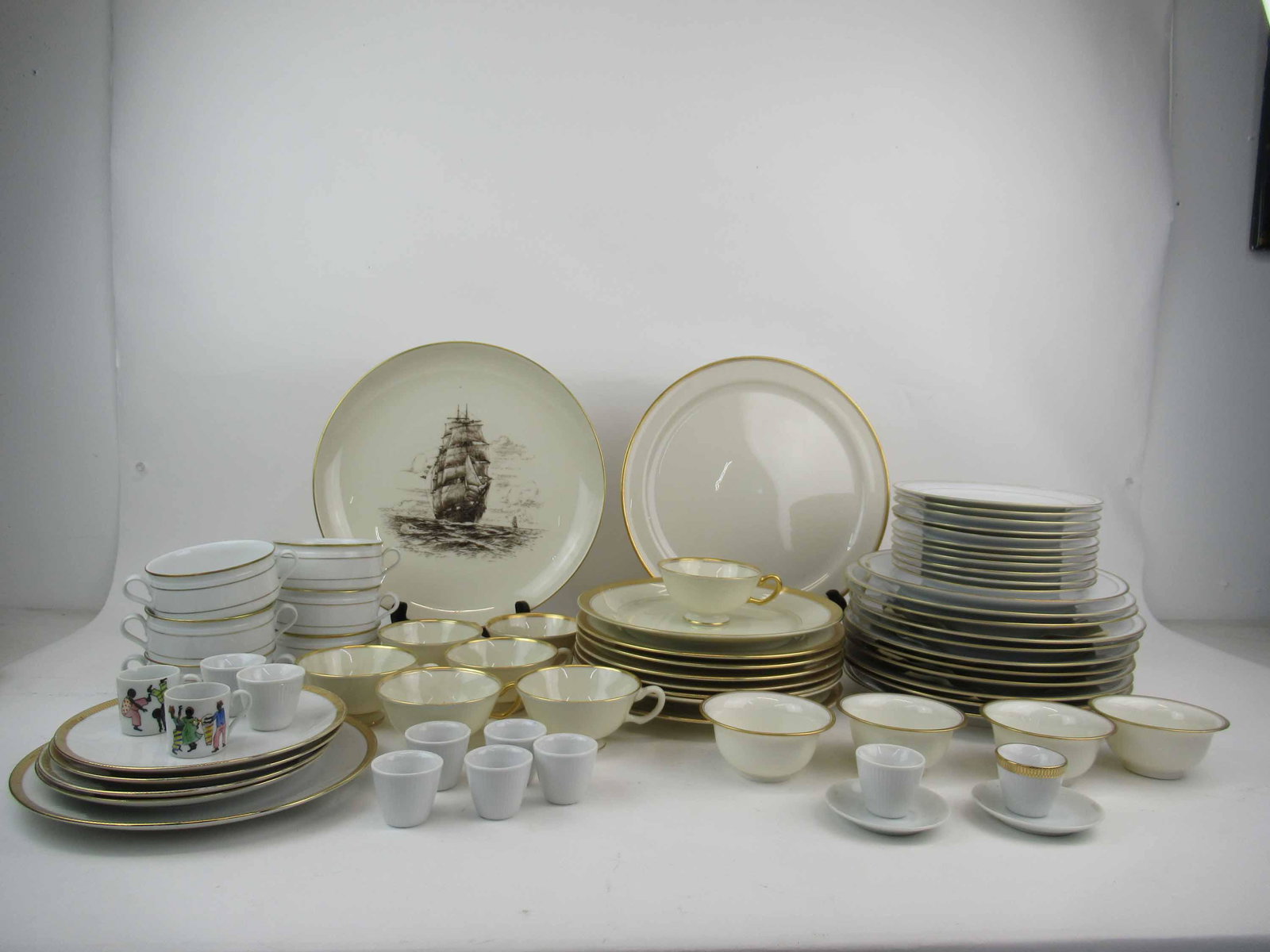 Group of Assorted Porcelain Dinnerware: Group of Assorted Porcelain Dinnerware. Including Tirschenreuth Bavaria Venezia 11 dinner, 11 salad, 6 cream soup, Rosenthal Ivory Imperial 8 dinner, Lenox 2 chargers, 7 Mansfield cups, Leftmann Germa