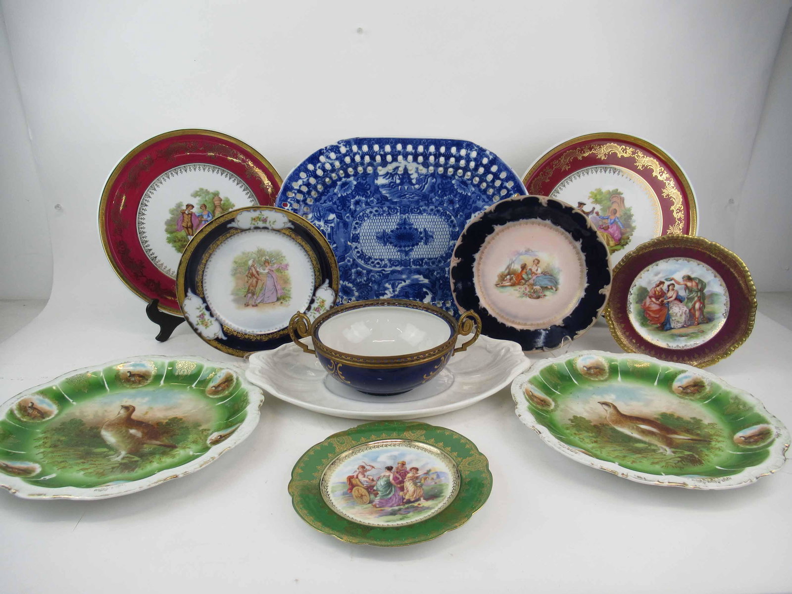 Group of Assorted Porcelain Table Articles: Group of Assorted Porcelain Table Articles. Including plates serving trays , portrait plates and Ironstone serving platters. Used condition, wear, worn, chips. 11 pieces