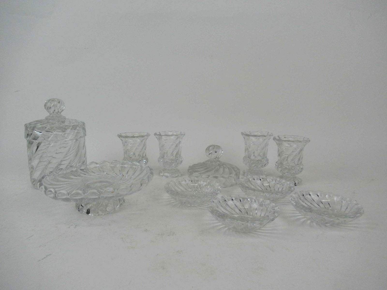 Group Of Baccarat Bambous Glass Table Articles: Group Of Baccarat Bambous Glass Table Articles. Including 4 toothpick holders, 4 salts one with chip, toothpicks, lidded jar and footed dish. Used condition. lidded jar 5 3/4" tall x 3 1/2" diameter.
