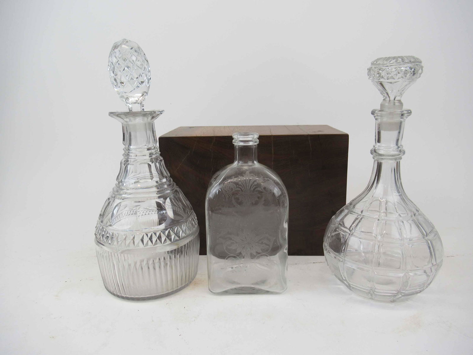 Group of Assorted Glass Table Articles: Group of Assorted Glass Table Articles. Including Antique Acid etched spirit bottle with dolphins, decanters and vintage glass wine cooler dispenser. Used condition, wear, worn.