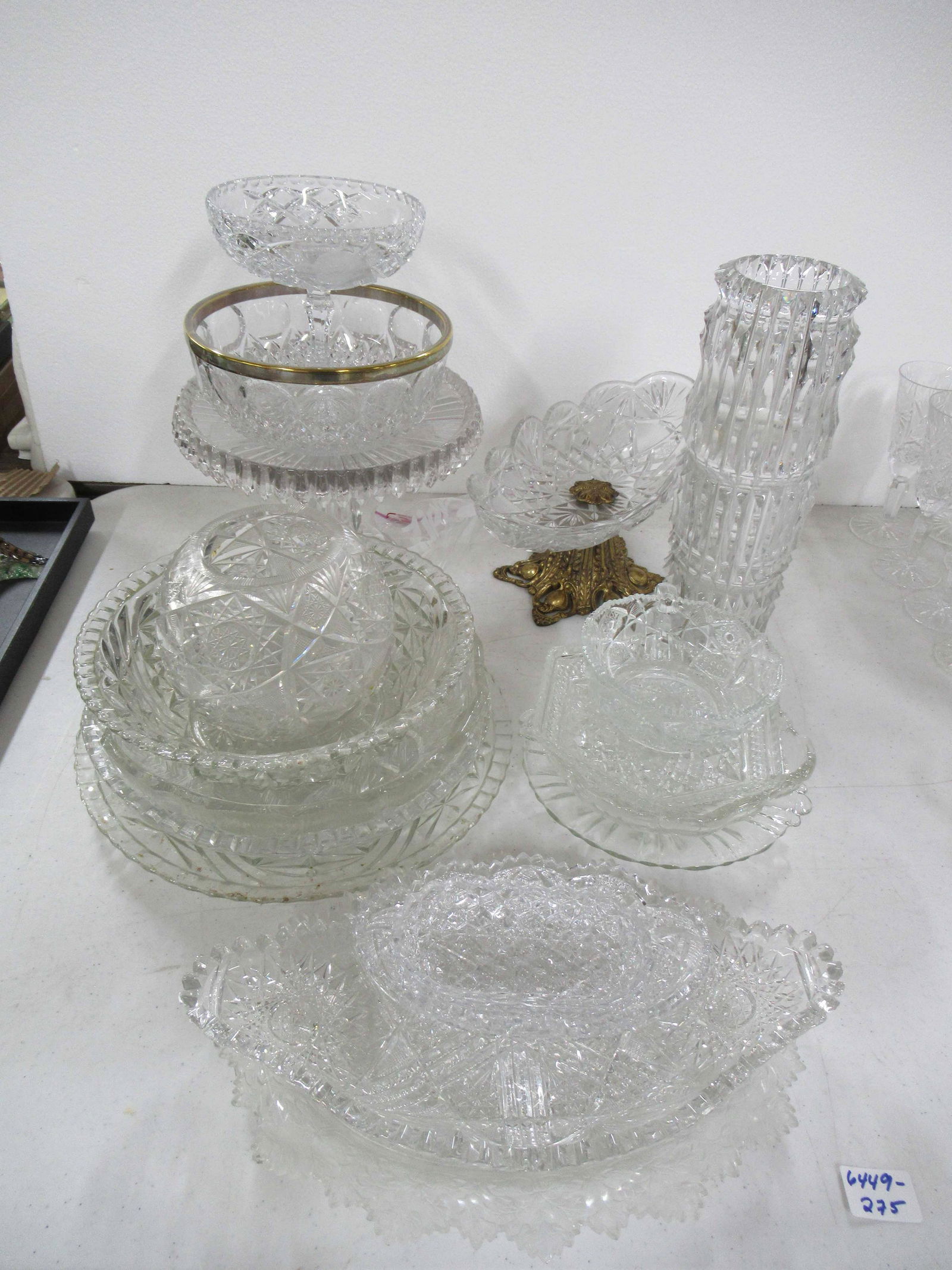 Group of Assorted Glass Table Articles: Group of Assorted Glass Table Articles. Comprising of cut and pressed glass, cake stand, compotes, rose bowl, assorted plates and dishes. Used condition, wear, worn, chips.